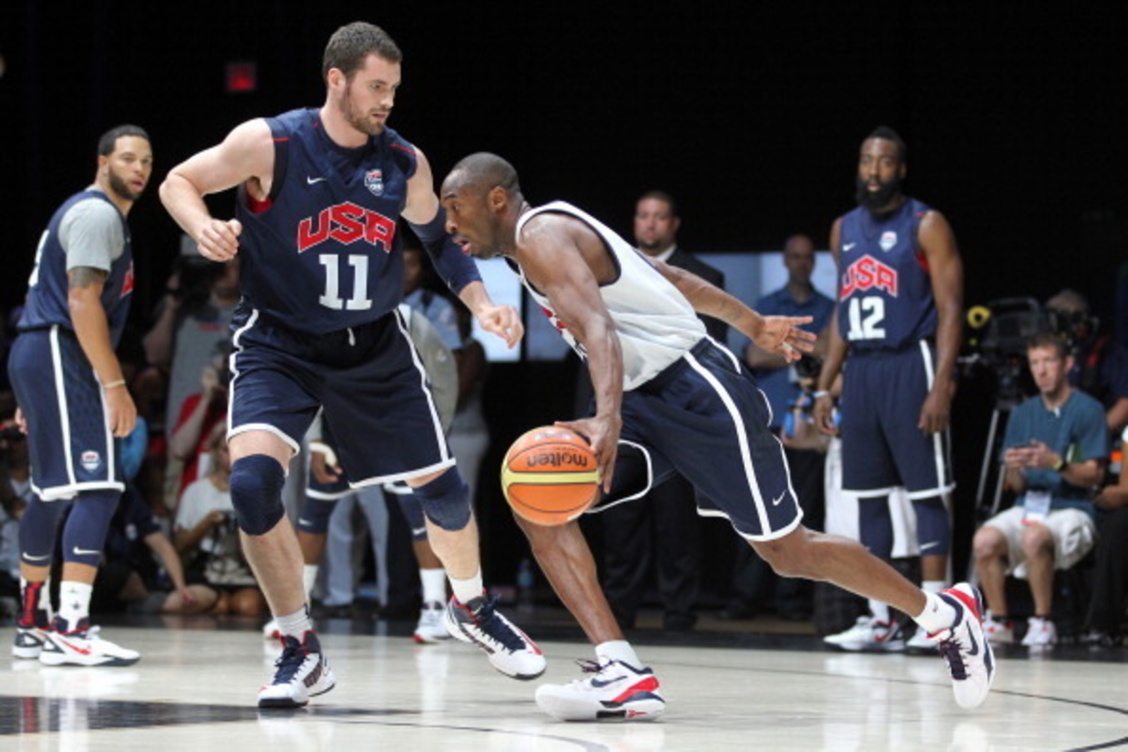 WASHINGTON, DC - JULY 14: Kobe Bryant #10 of the USA Men's Senior National Team drives against Kevin Love #11 at the DC Armory during USA Men's Senior National Team training camp at on July 14, 2012 in Washington, DC. NOTE TO USER: User expressly acknowle