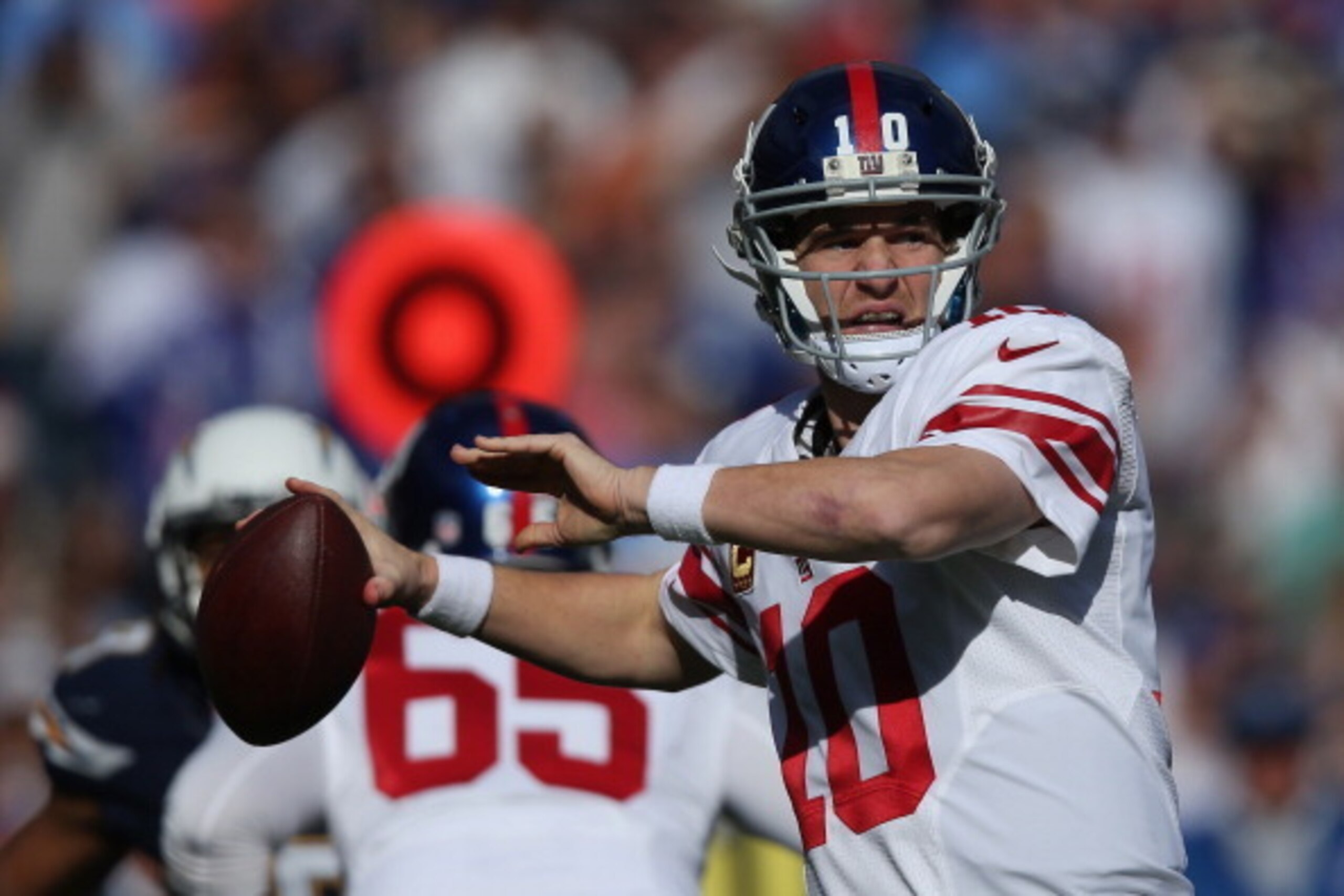 SAN DIEGO, CA - DECEMBER 08:  Quarterback Eli Manning #10 of the New York Giants drops back to pass against the San Diego Chargers at Qualcomm Stadium on December 8, 2013 in San Diego, California.  (Photo by Jeff Gross/Getty Images)