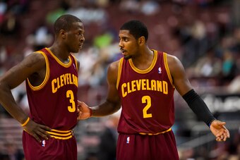 Oct 17, 2012; Philadelphia, PA, USA; Cleveland Cavaliers guard Kyrie Irving (2) talks with guard Dion Waiters (3) during the second quarter against the Philadelphia 76ers at the Wachovia Center. Mandatory Credit: Howard Smith-USA TODAY Sports