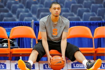 SYRACUSE, NY - FEBRUARY 15:  Tyler Ennis #11 of the Syracuse Orange looks on prior to the game against the North Carolina State Wolfpack at the Carrier Dome on February 15, 2014 in Syracuse, New York.  (Photo by Rich Barnes/Getty Images)
