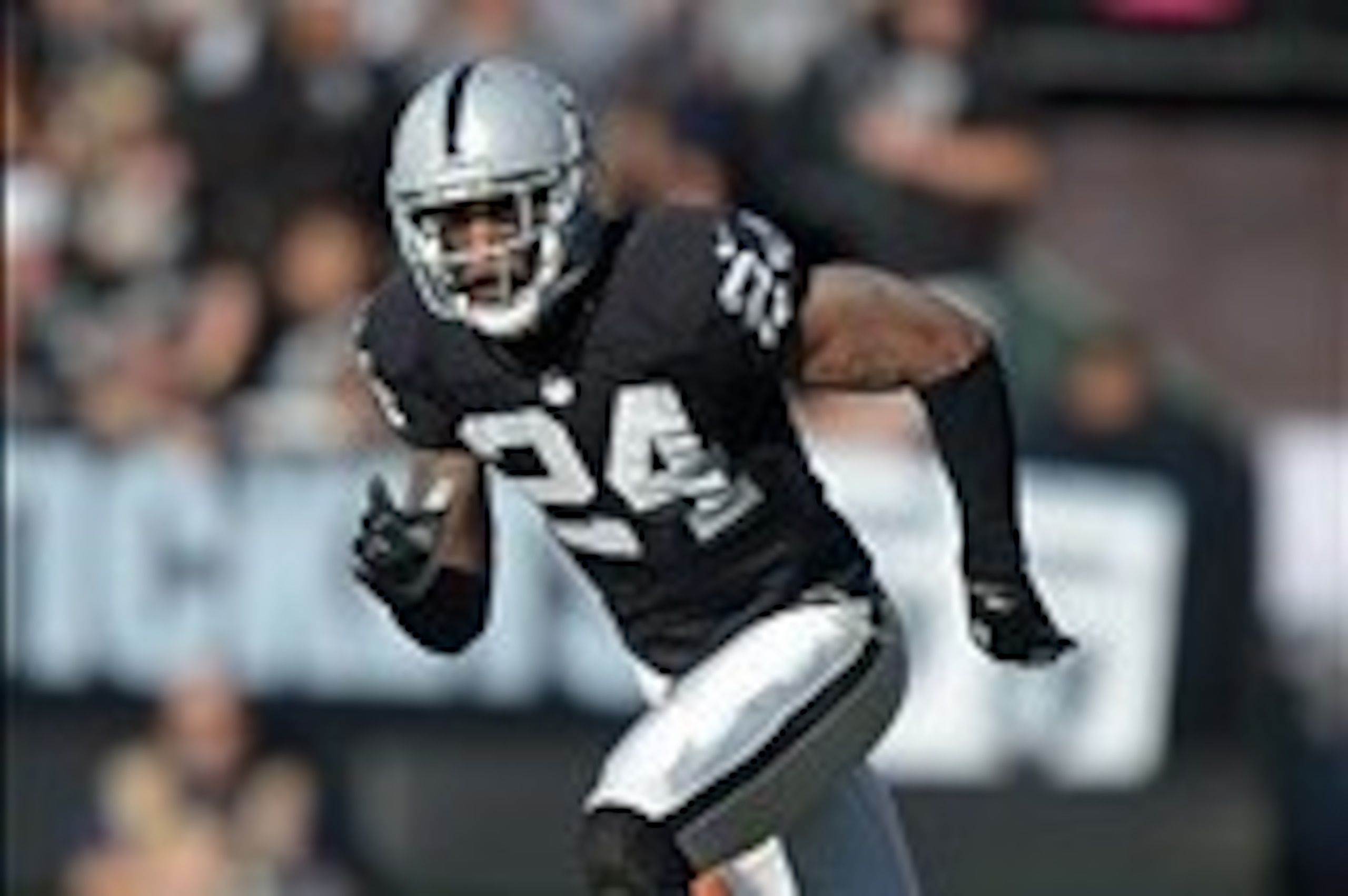 Dec 29, 2013; Oakland, CA, USA; Oakland Raiders safety Charles Woodson (24) during the game against the Denver Broncos at O.co Coliseum. The Broncos defeated the Raiders 34-14. Mandatory Credit: Kirby Lee-USA TODAY Sports Dec 29, 2013; Oakland, CA, USA; Oakland Raiders safety Charles Woodson (24) during the game against the Denver Broncos at O.co Coliseum. The Broncos defeated the Raiders 34-14. Mandatory Credit: Kirby Lee-USA TODAY Sports