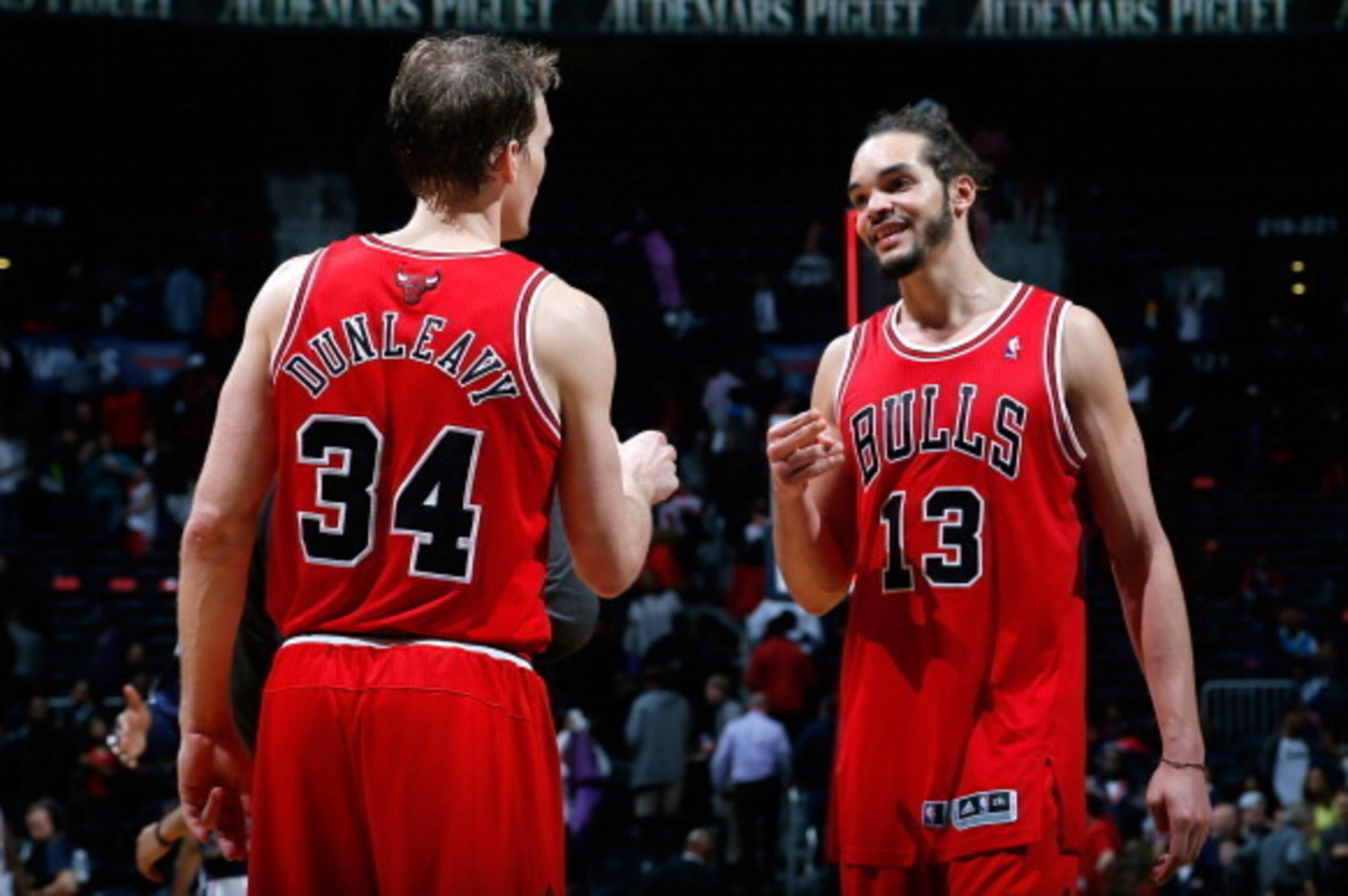 ATLANTA, GA - FEBRUARY 25:  Joakim Noah #13 and Mike Dunleavy #34 of the Chicago Bulls celebrate their 107-103 win over the Atlanta Hawks at Philips Arena on February 25, 2014 in Atlanta, Georgia.  NOTE TO USER: User expressly acknowledges and agrees that