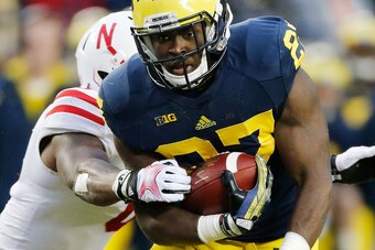 ANN ARBOR, MI - NOVEMBER 09:  Derrick Green #27 of the Michigan Wolverines breaks a tackle in the second quarter against the Nebraska Cornhuskers at Michigan Stadium on November 9, 2013 in Ann Arbor, Michigan.  (Photo by Gregory Shamus/Getty Images)
