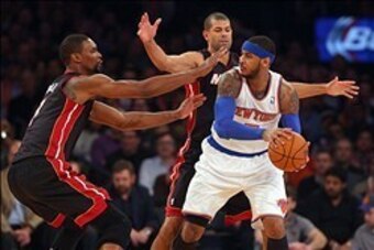 Feb 1, 2014; New York, NY, USA; New York Knicks small forward Carmelo Anthony (7) is defended by Miami Heat center Chris Bosh (1) and small forward Shane Battier (31) during the first period of a game at Madison Square Garden. Mandatory Credit: Brad Penne
