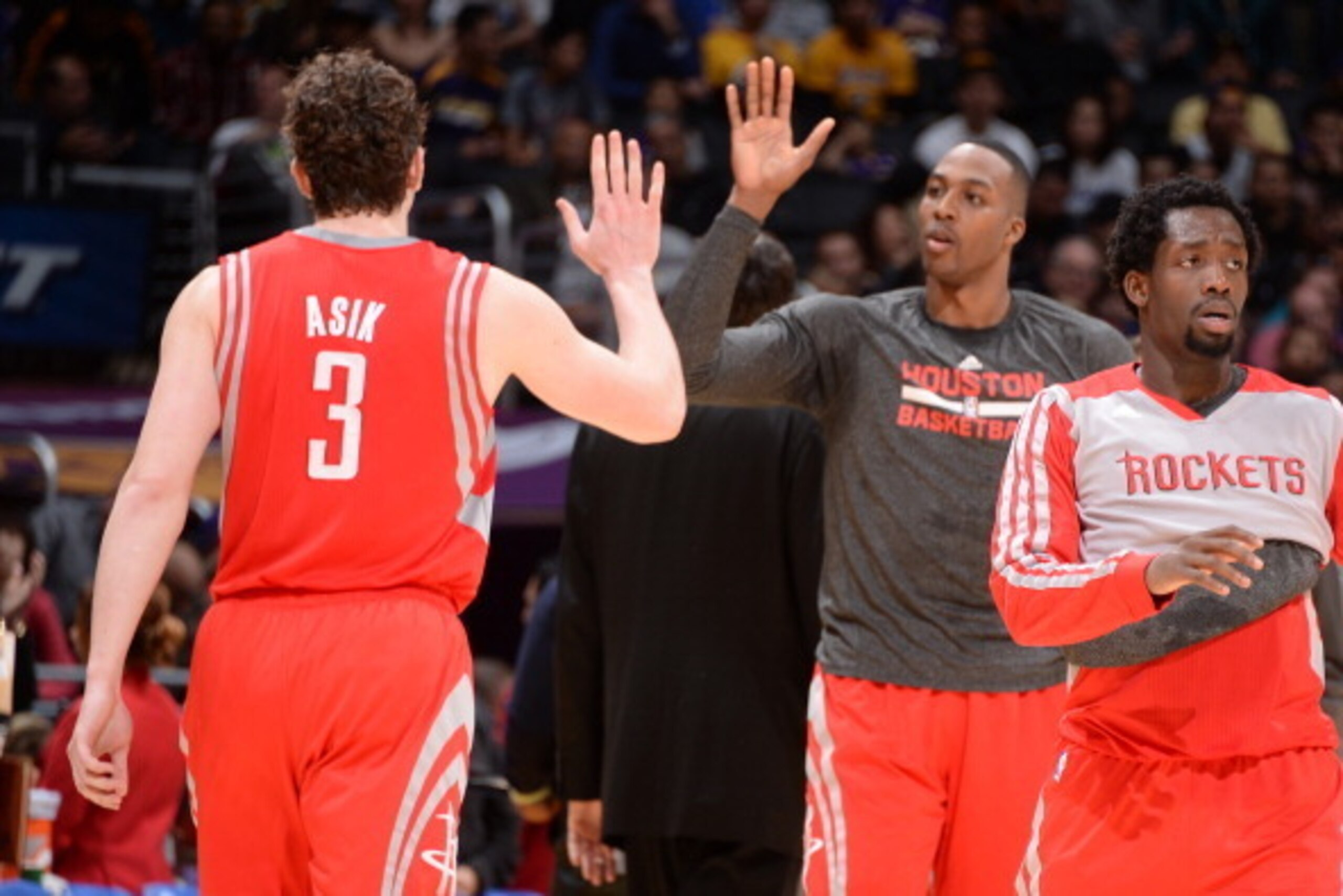 LOS ANGELES, CA - FEBRUARY 19: Omer Asik #3 and Dwight Howard #12 of the Houston Rockets high five during a game against the Los Angeles Lakers at STAPLES Center on February 19, 2014 in Los Angeles, California. NOTE TO USER: User expressly acknowledges an