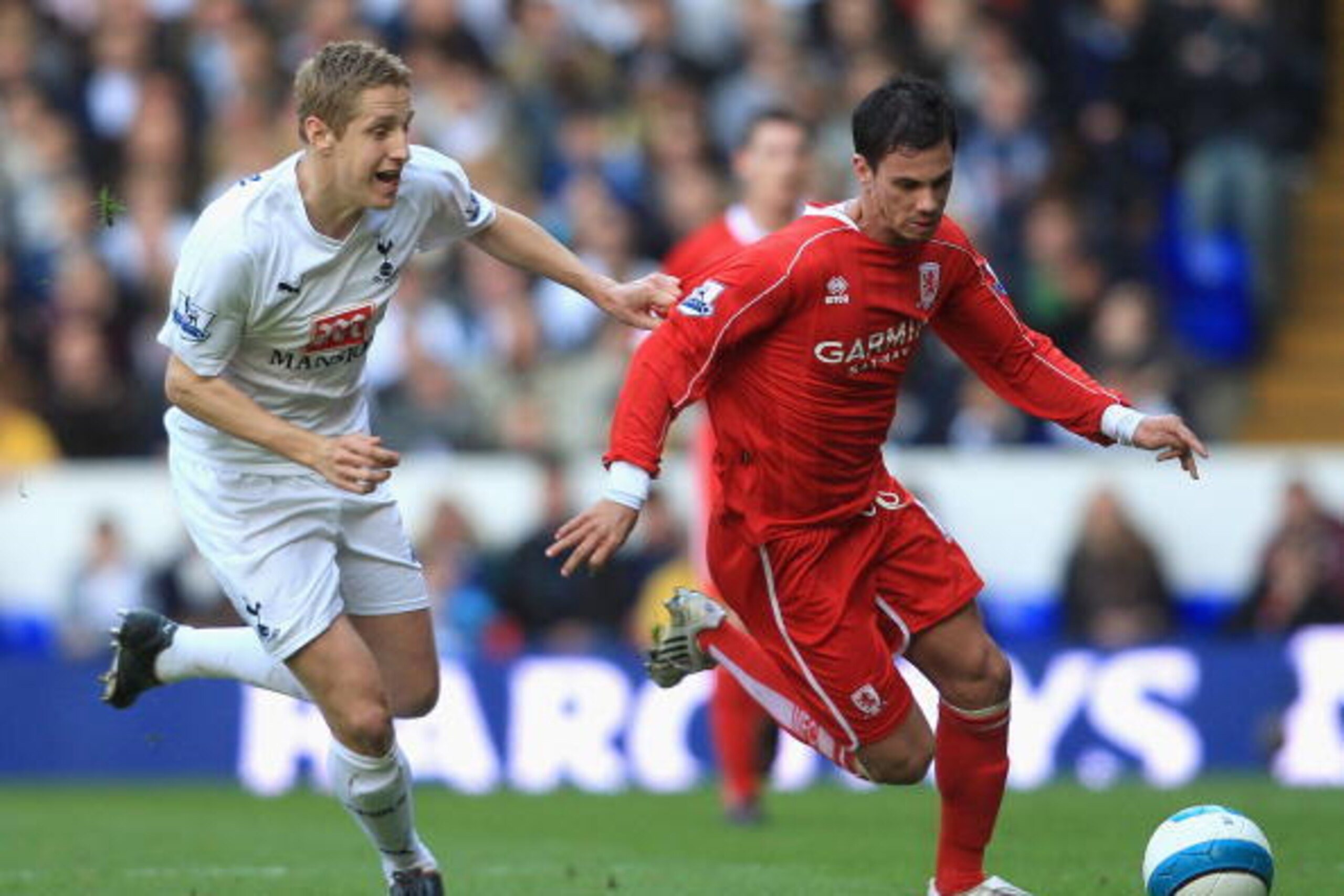 LONDON - APRIL 12:  Michael Dawson of Tottenham Hotspur pulls the shirt of Jeremie Aliadiere of Middlesbrough during the Barclays Premier League match between Tottenham Hotspur and Middlesbrough at White Hart Lane on April 12, 2008 in London, England.  (P