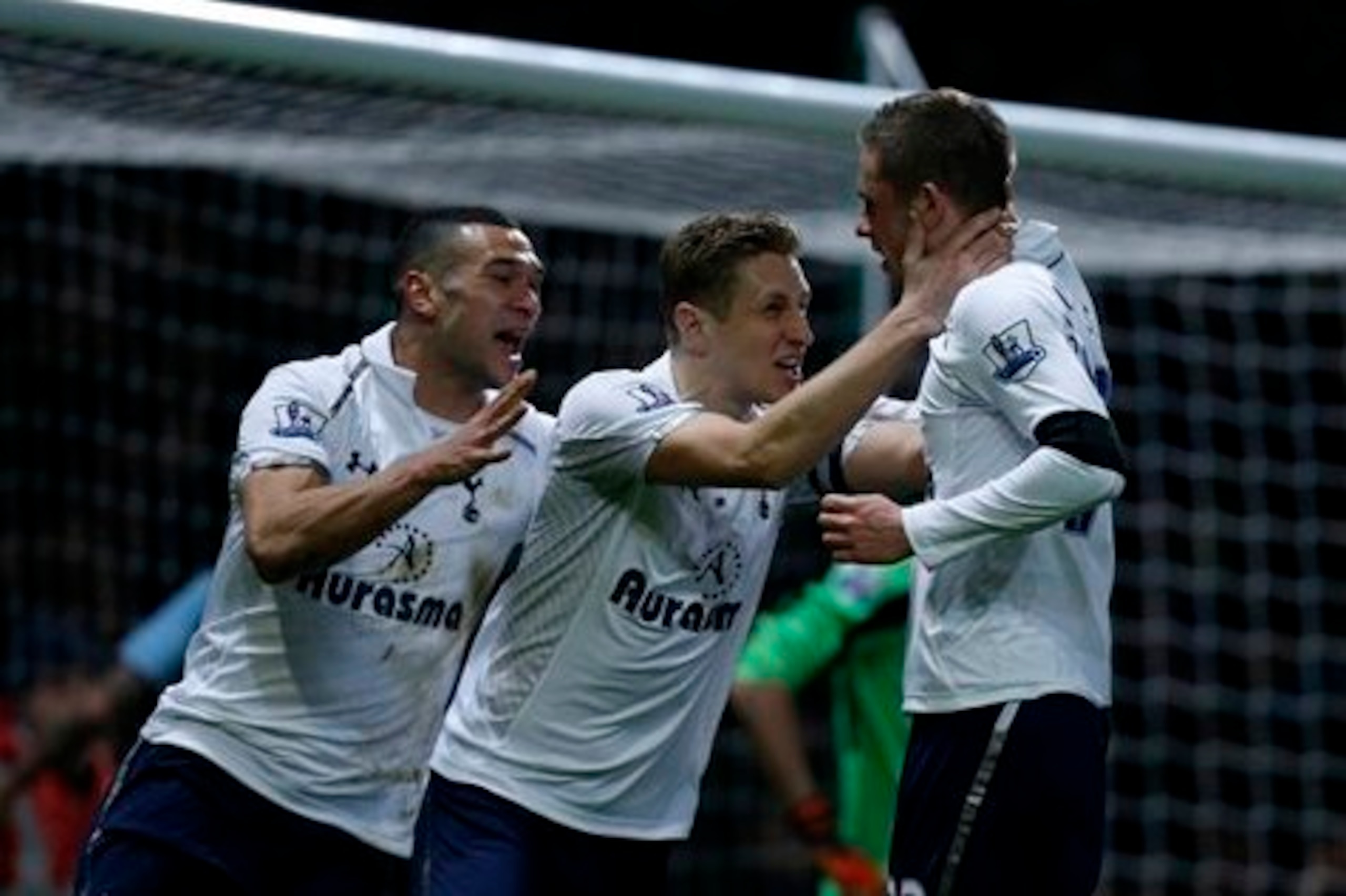 Steven Caulker and Michael Dawson celebrate with Gylfi Sigurdsson after the latter scored against West Ham United last season.