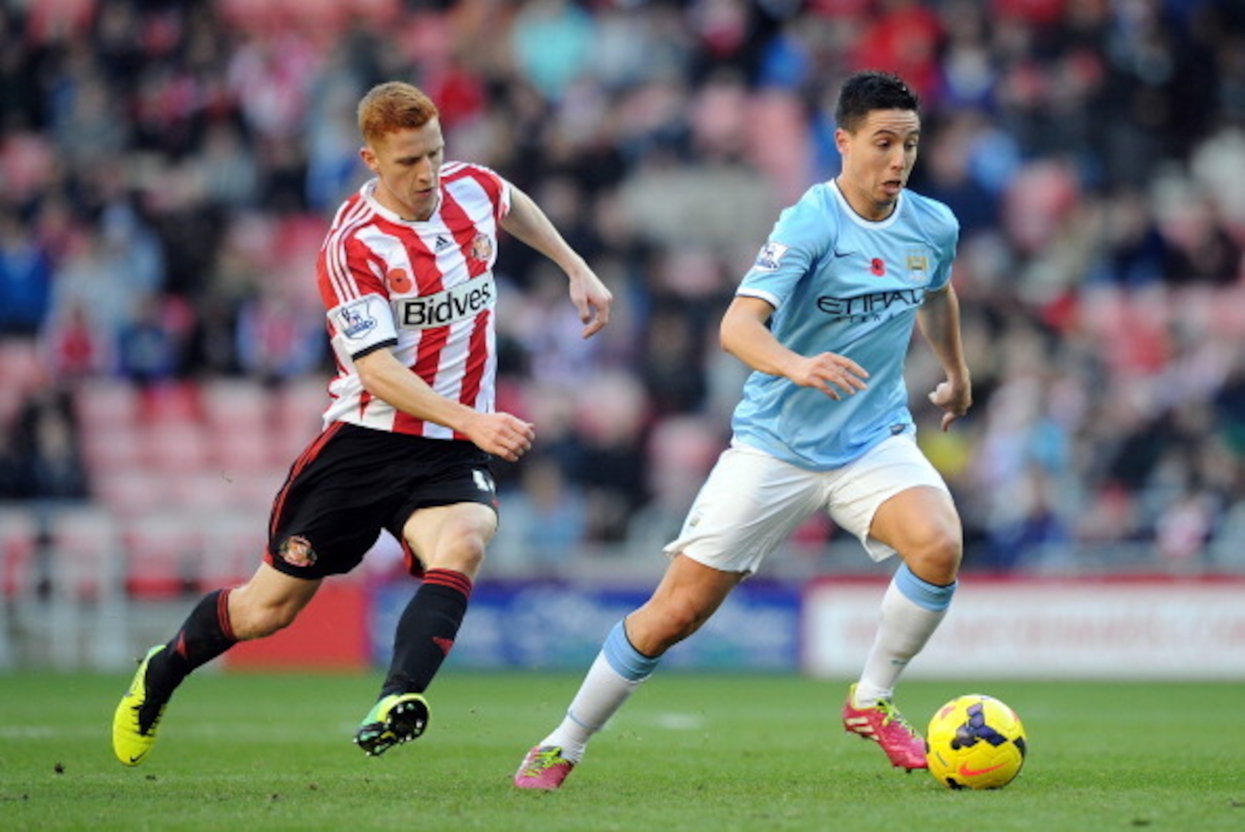 SUNDERLAND, ENGLAND - NOVEMBER 10: Jack Colback of Sunderland in action with Samir Nasri of Manchester City during the Barclays Premier League match between Sunderland and Manchester City at Stadium of Light on November 10, 2013 in Sunderland, England. (P