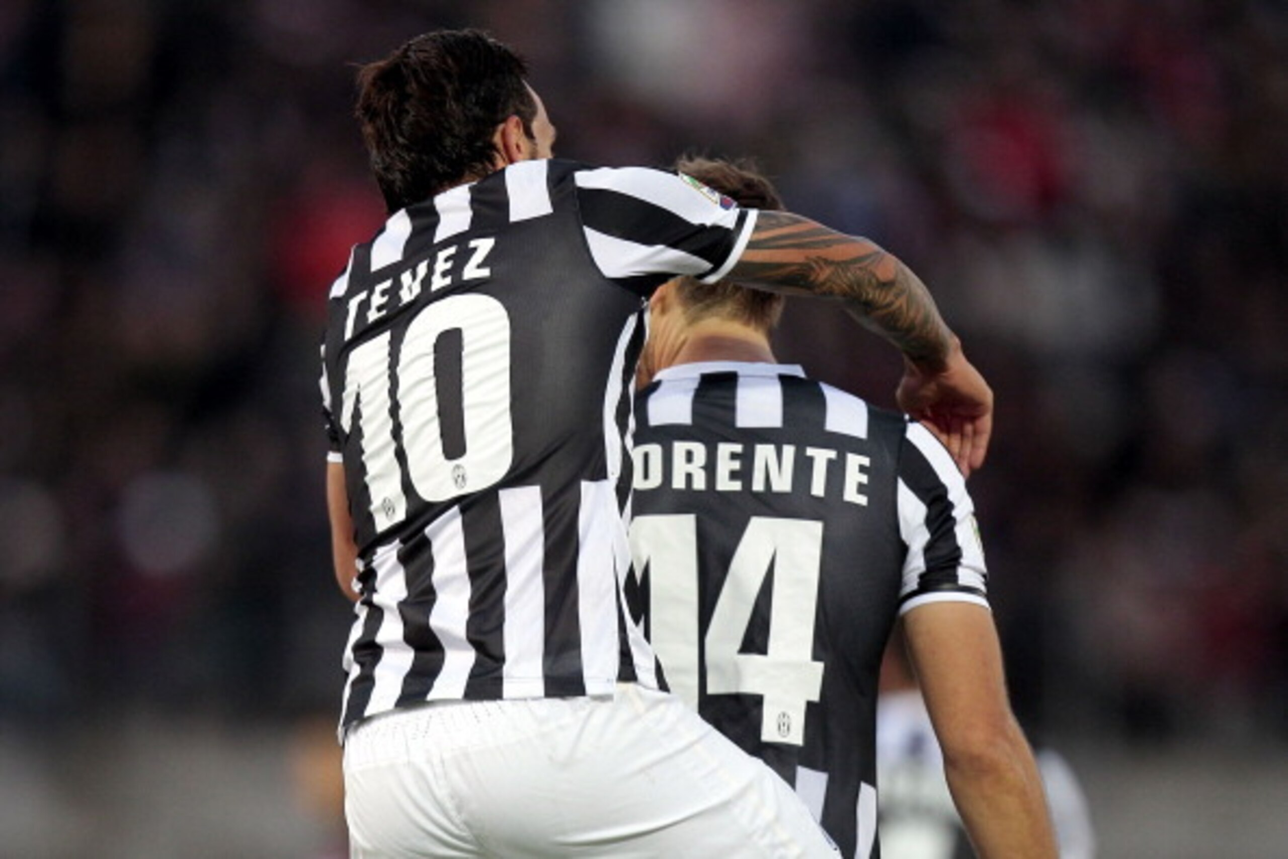 LIVORNO, ITALY - NOVEMBER 24: Carlos Tevez and Fernando Torres Llorente of Juventus FC celebrate after scoring a goal during the Serie A match between AS Livorno Calcio and Juventus at Stadio Armando Picchi on November 24, 2013 in Livorno, Italy.  (Photo 