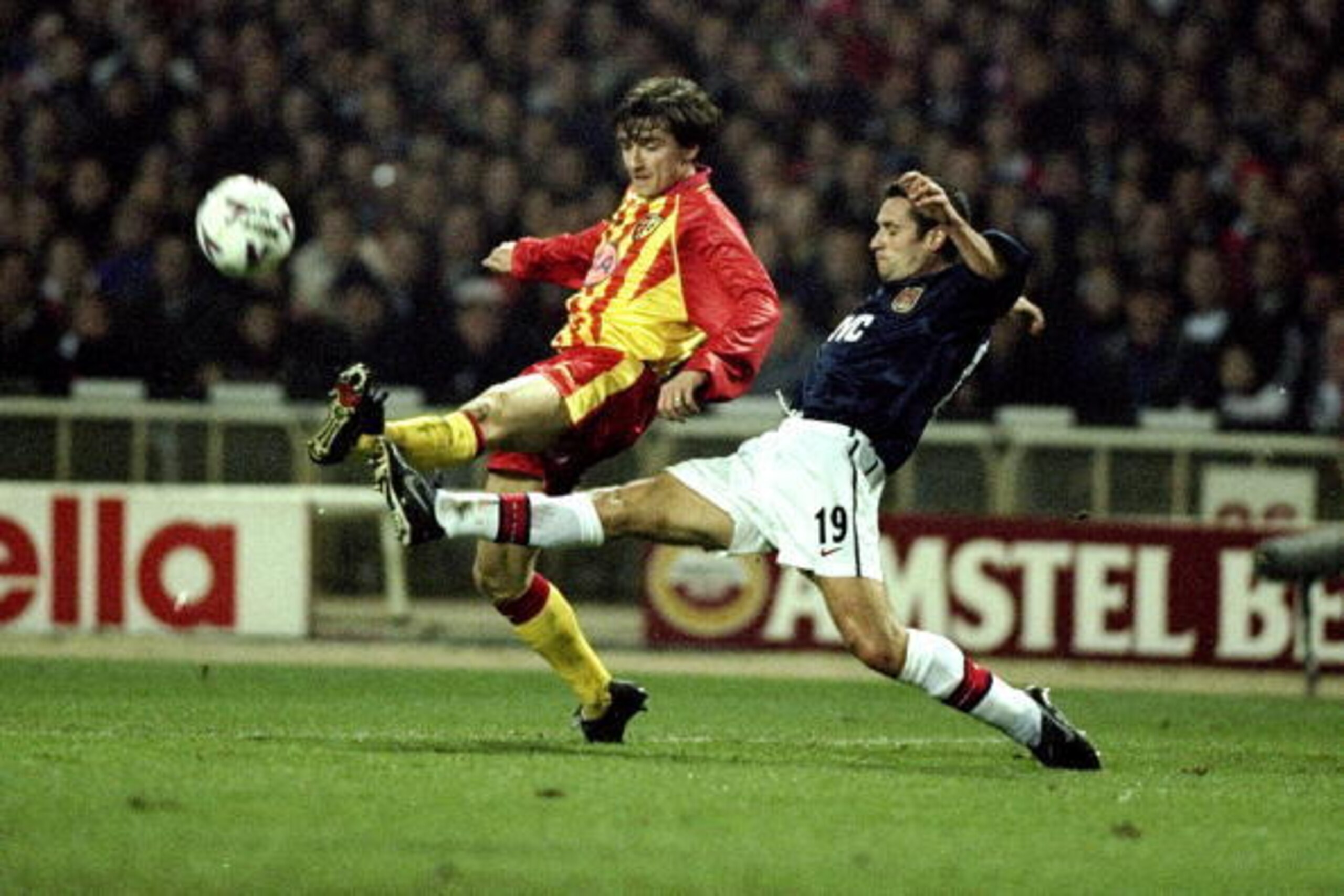 25 Nov 1998:  Remi Garde of Arsenal stretches to deny Vladimir Smicer of Lens in the UEFA Champions League match at Wembley in London. Arsenal lost 1-0 to crash out of the competition. \ Mandatory Credit: Mark Thompson /Allsport