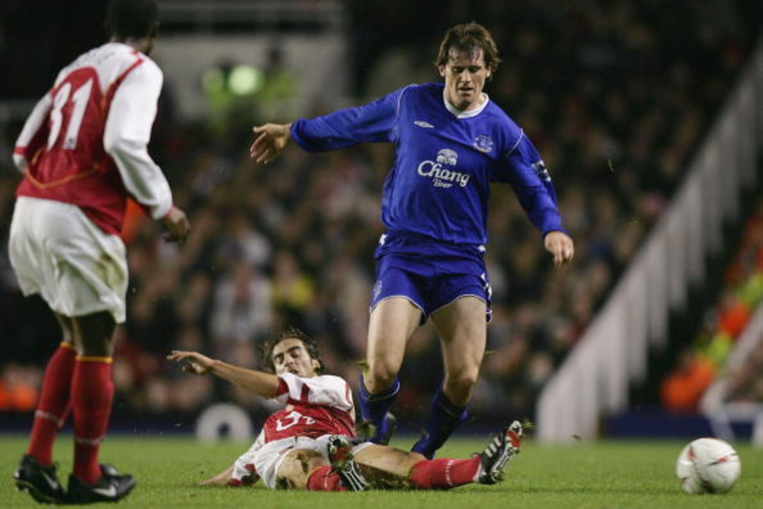 LONDON - NOVEMBER 9: Kevin Kilbane of Everton is tackled by Mathieu Flamini of Arsenal during the Carling Cup Fourth Round match between Arsenal and Everton at Highbury on November 9, 2004 in London, England. (Photo by Ben Radford/Getty Images)