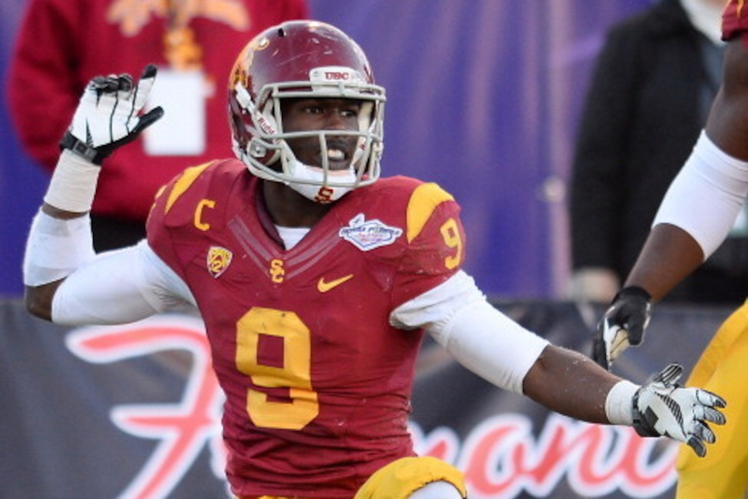 LAS VEGAS, NV - DECEMBER 21:  Marqise Lee #9 of the USC Trojans reacts after getting a first down against the Fresno State Bulldogs during the Royal Purple Las Vegas Bowl at Sam Boyd Stadium on December 21, 2013 in Las Vegas, Nevada. USC won 45-20.  (Phot