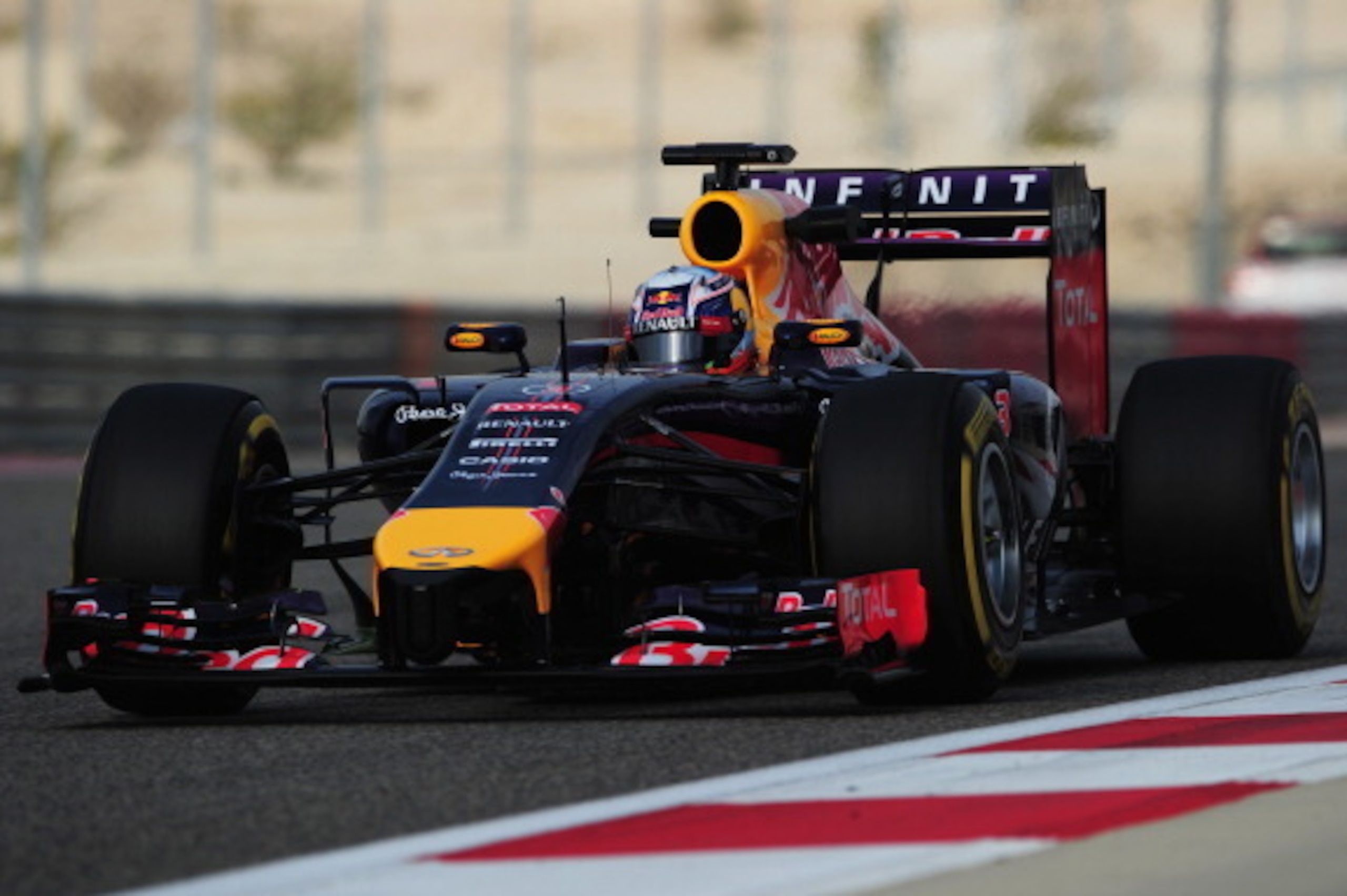 BAHRAIN, BAHRAIN - FEBRUARY 28:  Daniel Ricciardo of Australia and Infiniti Red Bull Racing drives during day two of Formula One Winter Testing at the Bahrain International Circuit on February 28, 2014 in Bahrain, Bahrain.  (Photo by Shaun Botterill/Getty