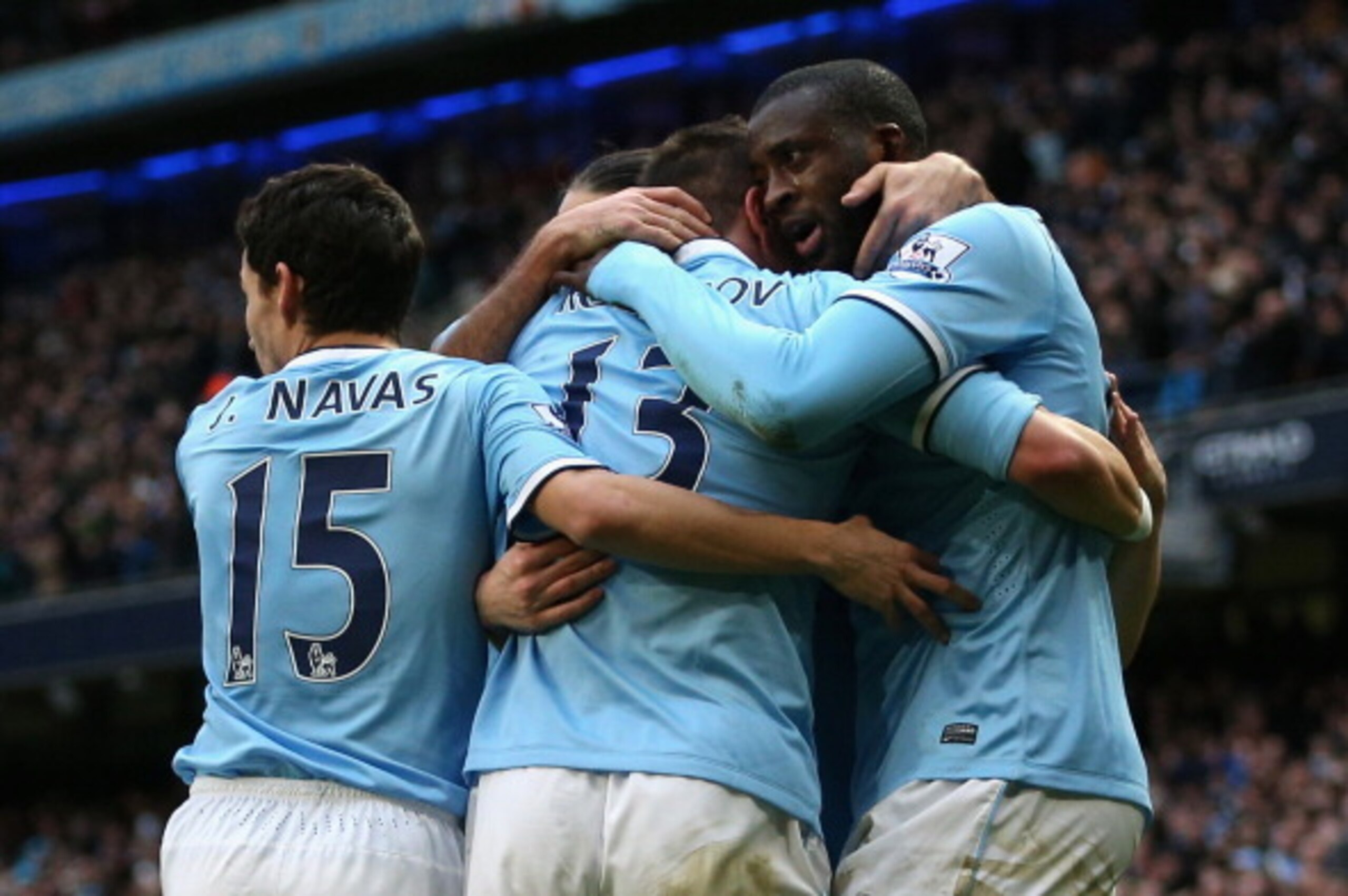 MANCHESTER, ENGLAND - FEBRUARY 22:  Yaya Toure of Manchester City celebrates scoring the opening goal with his team-mates during the Barclays Premier League match between Manchester City and Stoke City at the Etihad Stadium on February 22, 2014 in Manches