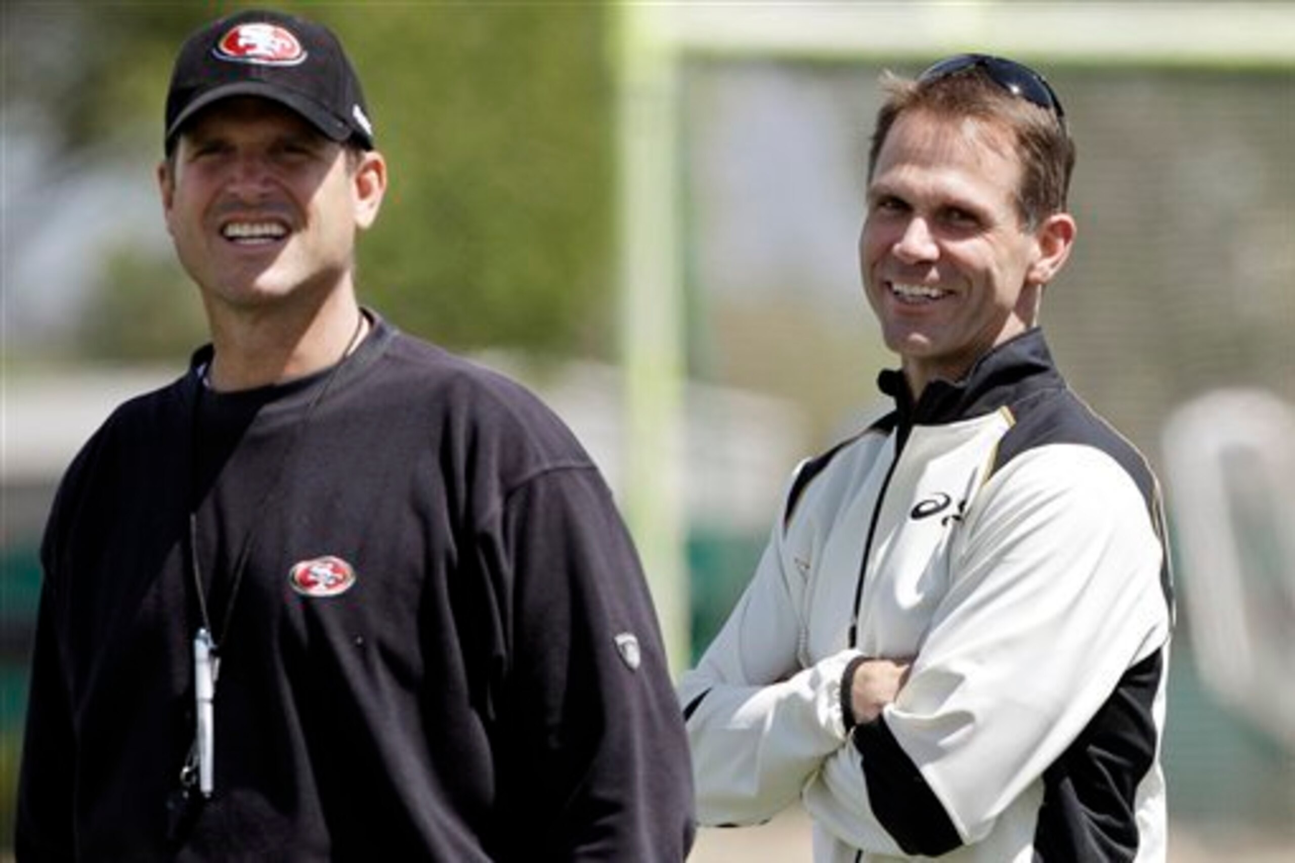 Head coach Jim Harbaugh (left) and GM Trent Baalke (right) have the 49ers sitting at No. 20 in NFL cap space.