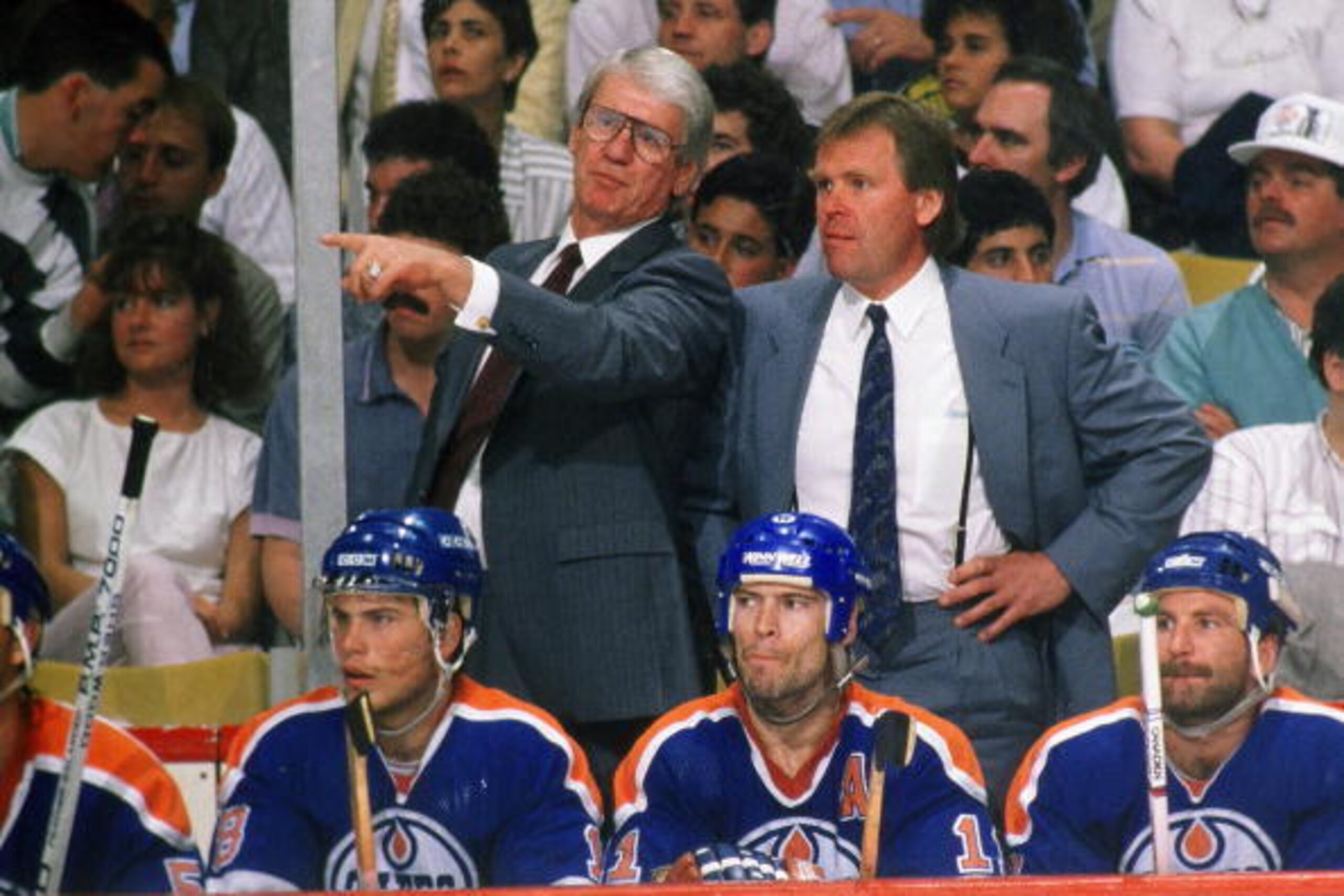 BOSTON, MA. - 1980's: Glen Sather head coach and assistant coach John Muckler of the Edmonton Oilers direct action from behind bench against the Boston Bruins at Boston Garden.  (Photo by Steve Babineau/NHLI via Getty Images)