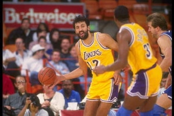1990-1991:  Center Vlade Divac of the Los Angeles Lakers moves the ball during a game at the Great Western Forum in Inglewood, California. Mandatory Credit: Ken Levine  /Allsport Mandatory Credit: Ken Levine  /Allsport