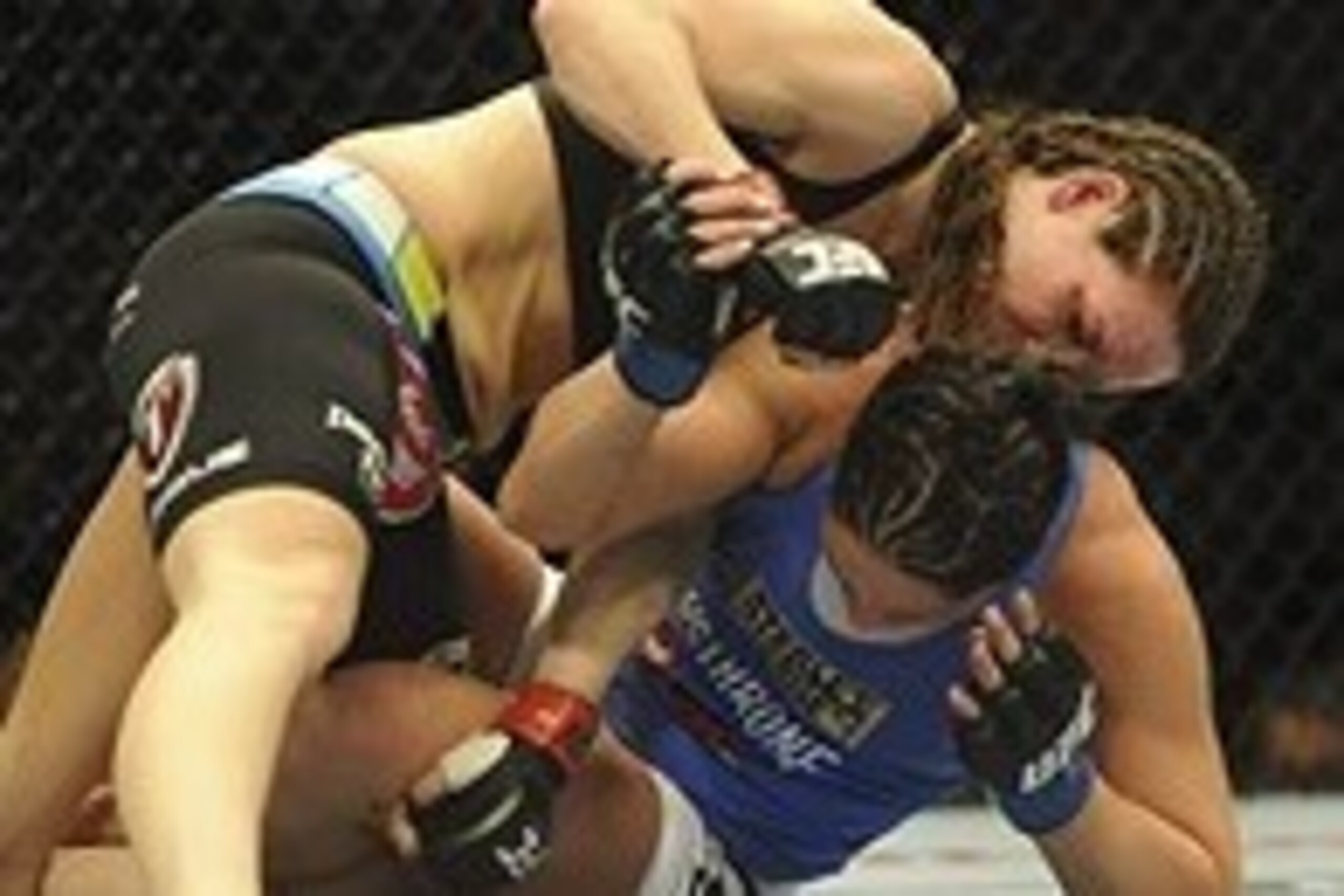 Feb 22, 2014; Las Vegas, NV, USA; Jessica Eye (blue gloves) fights to get out from under Alexis Davis (red gloves) during their UFC bantamweight bout at Mandalay Bay. Davis won by split decision.  Mandatory Credit: Stephen R. Sylvanie-USA TODAY Sports