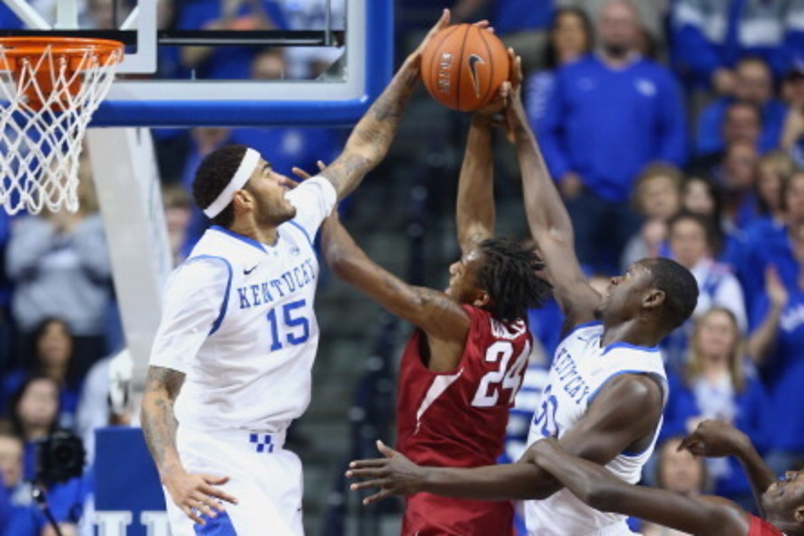 LEXINGTON, KY - FEBRUARY 27:  Michael Qualls #24 of the Arkansas Razorbacks shoots the ball during whhile defended by Willie Cauley-Stein and Julius Randle #30 of the Kentucky Wildcats at Rupp Arena on February 27, 2014 in Lexington, Kentucky.  (Photo by 