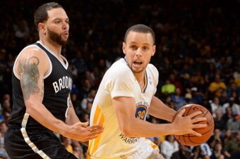 OAKLAND, CA - FEBRUARY 22: Stephen Curry #30 of the Golden State Warriors drives to the basket during a game against the Brooklyn Nets at Oracle Arena on February 22, 2014 in Oakland, California. NOTE TO USER: User expressly acknowledges and agrees that, OAKLAND, CA - FEBRUARY 22: Stephen Curry #30 of the Golden State Warriors drives to the basket during a game against the Brooklyn Nets at Oracle Arena on February 22, 2014 in Oakland, California. NOTE TO USER: User expressly acknowledges and agrees that,