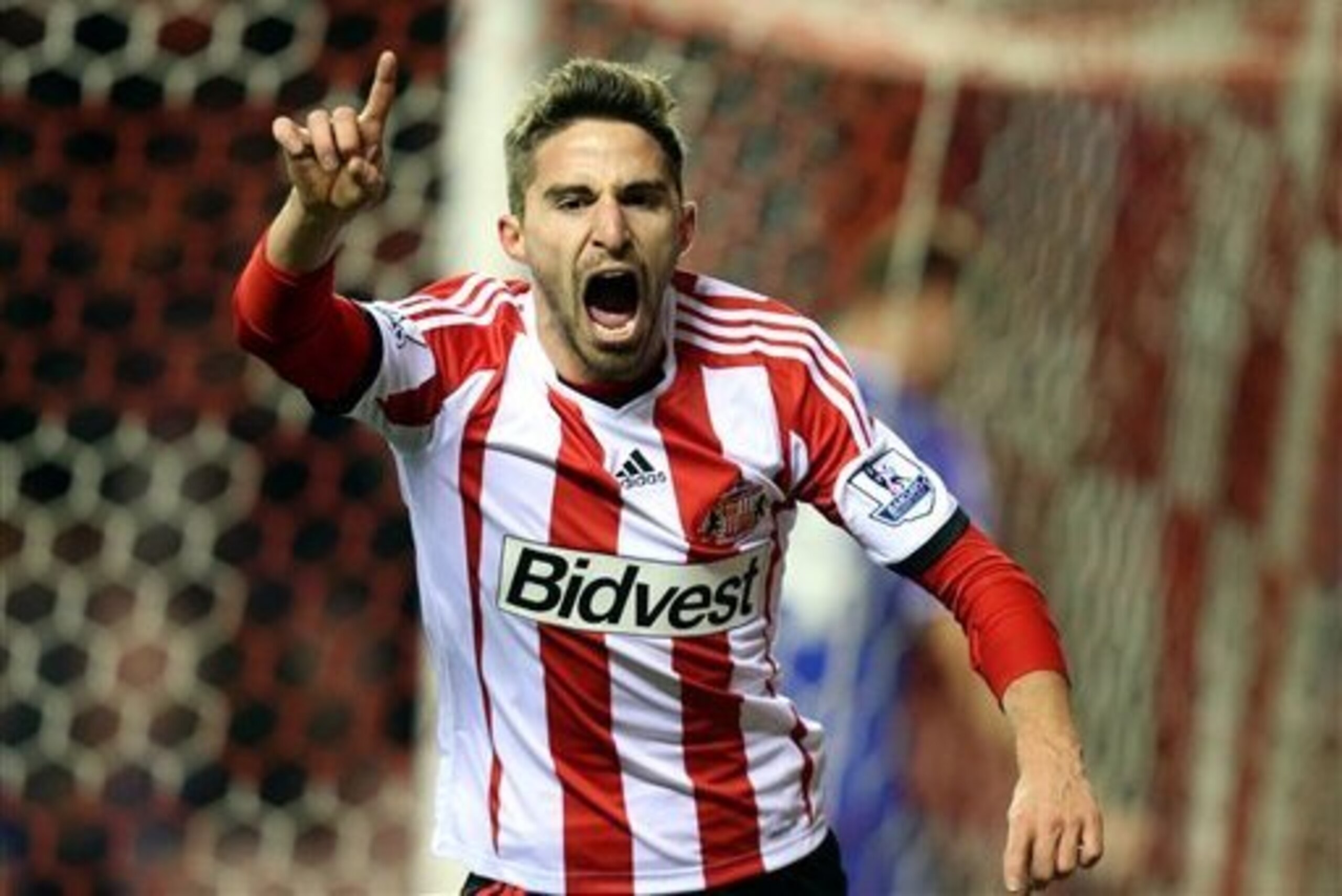 GOAL! Borini celebrates his strike against Chelsea.