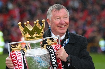 MANCHESTER, ENGLAND - MAY 12:  Manchester United Manager Sir Alex Ferguson celebrates with the Premier League trophy following the Barclays Premier League match between Manchester United and Swansea City at Old Trafford on May 12, 2013 in Manchester, Engl