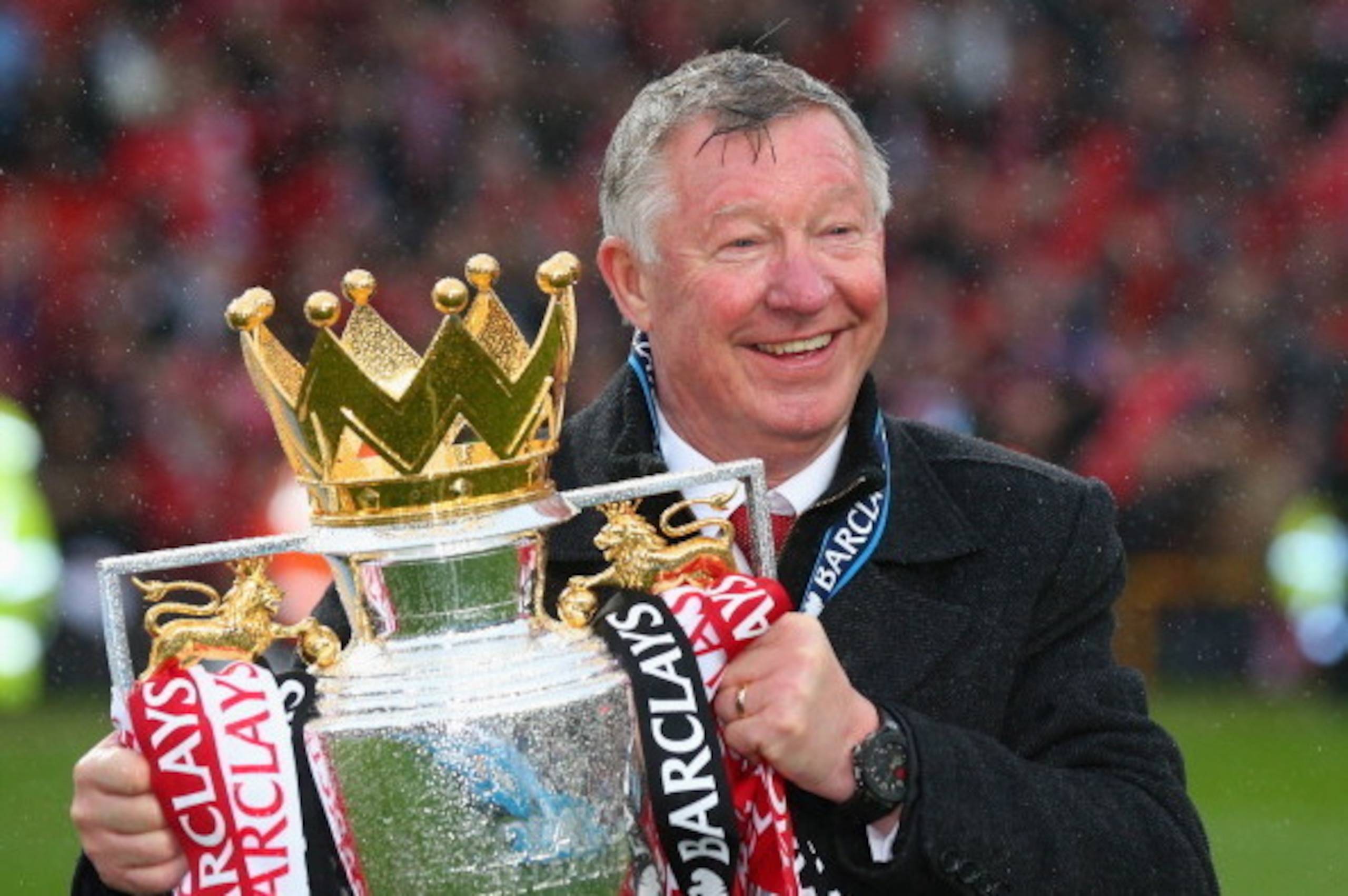 MANCHESTER, ENGLAND - MAY 12:  Manchester United Manager Sir Alex Ferguson celebrates with the Premier League trophy following the Barclays Premier League match between Manchester United and Swansea City at Old Trafford on May 12, 2013 in Manchester, Engl