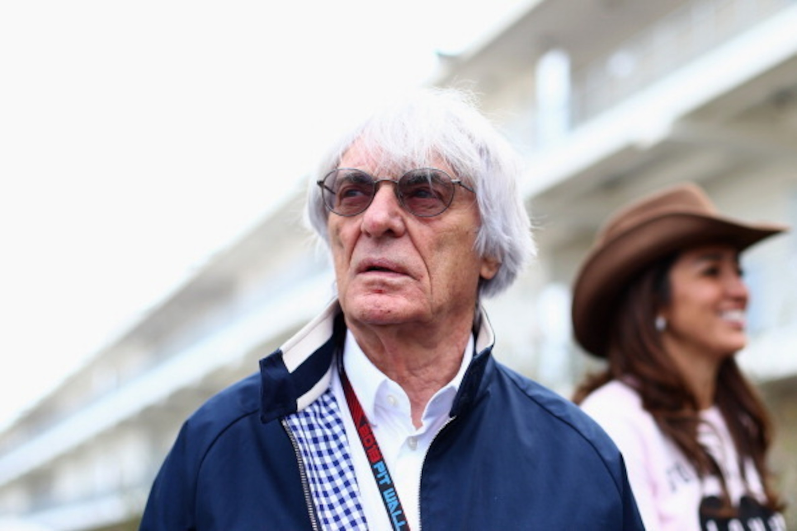 AUSTIN, TX - NOVEMBER 14:  F1 supremo Bernie Ecclestone and his wife Fabiana Flosi arrive in the paddock during previews to the United States Formula One Grand Prix at Circuit of The Americas on November 14, 2013 in Austin, United States.  (Photo by Paul 