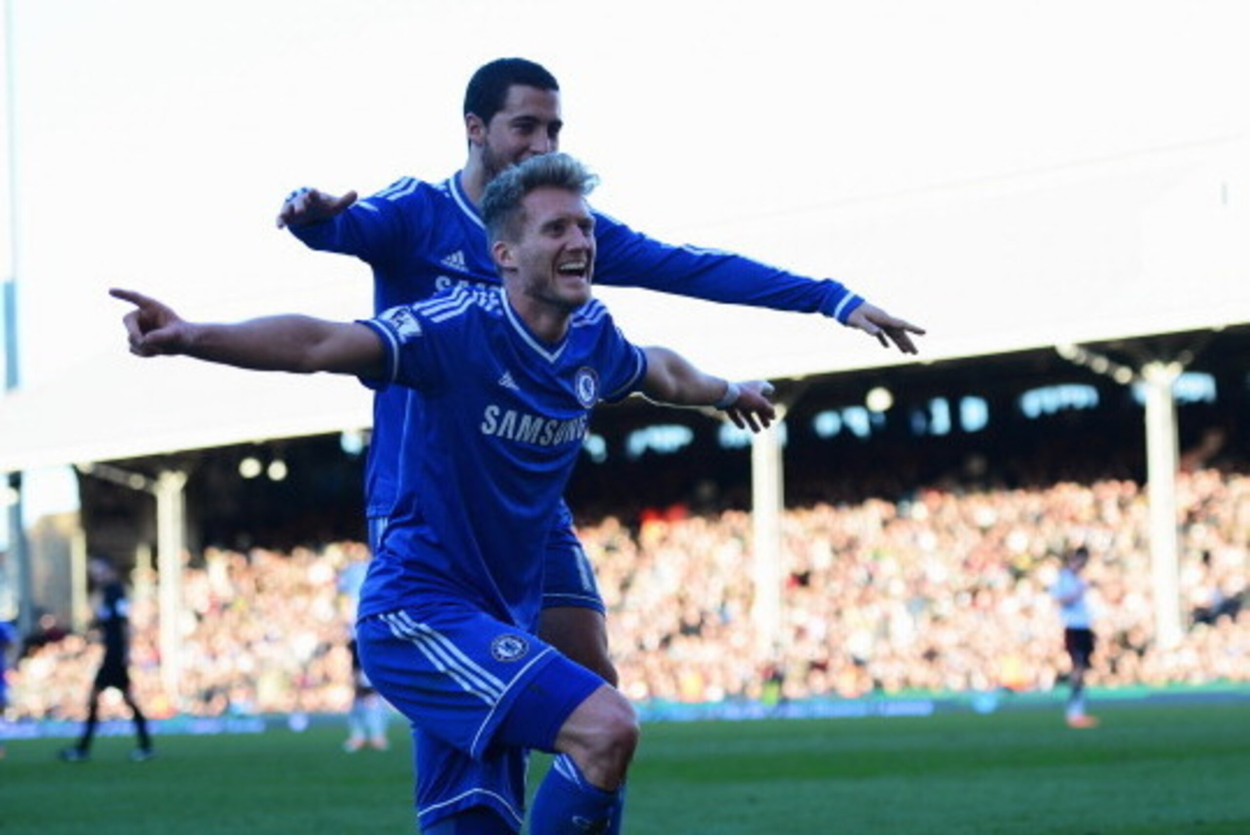 LONDON, ENGLAND - MARCH 01: Andre Schurrle of Chelsea celebrates with Eden Hazard as he scores their third goal and completes his hat trick during the Barclays Premier League match between Fulham and Chelsea at Craven Cottage on March 1, 2014 in London, LONDON, ENGLAND - MARCH 01: Andre Schurrle of Chelsea celebrates with Eden Hazard as he scores their third goal and completes his hat trick during the Barclays Premier League match between Fulham and Chelsea at Craven Cottage on March 1, 2014 in London,