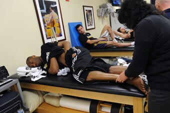 LOS ANGELES - APRIL 18:  Kobe Bryant #24, Jordan Farmar #1, and Pau Gasol #16 of the Los Angeles Lakers receive treatment in the training room before taking on the Oklahoma City Thunder in Game One of the Western Conference Quarterfinals during the 2010 N