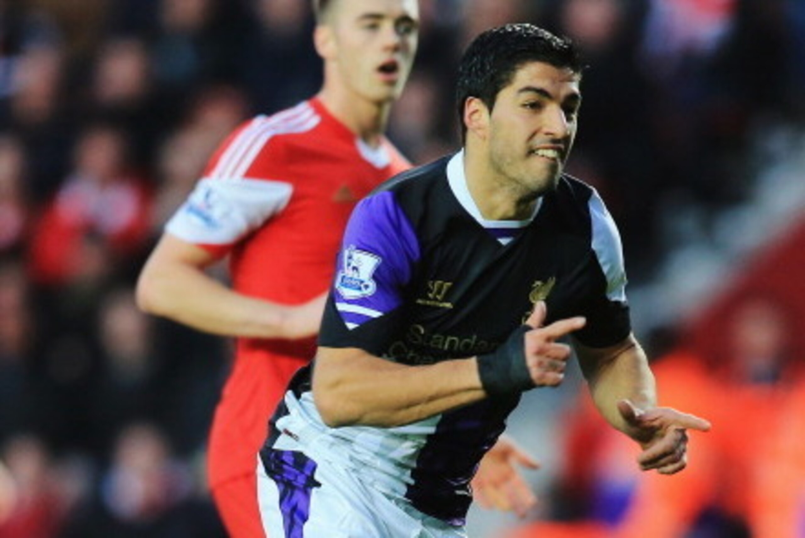 SOUTHAMPTON, ENGLAND - MARCH 01: Luis Suarez of Liverpool celebrates scoring the opening goal during the Barclays Premier League match between Southampton and Liverpool at St Mary's Stadium on March 1, 2014 in Southampton, England. (Photo by David Canno SOUTHAMPTON, ENGLAND - MARCH 01: Luis Suarez of Liverpool celebrates scoring the opening goal during the Barclays Premier League match between Southampton and Liverpool at St Mary's Stadium on March 1, 2014 in Southampton, England. (Photo by David Canno