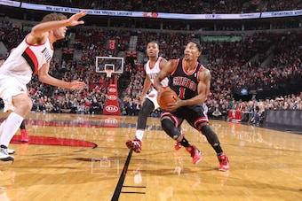PORTLAND, OR - NOVEMBER 22:  Derrick Rose #1 of the Chicago Bulls drives to the basket against the Portland Trail Blazers on November 22, 2013 at the Moda Center Arena in Portland, Oregon. NOTE TO USER: User expressly acknowledges and agrees that, by down