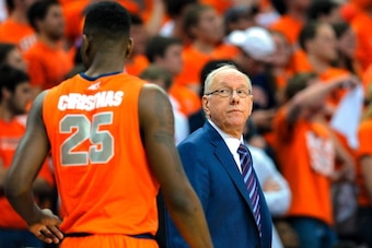 CHARLOTTESVILLE, VA - MARCH 01:  Head coach Jim Boeheim of the Syracuse Orange looks in the direction of Rakeem Christmas #25 during the first half at John Paul Jones Arena on March 1, 2014 in Charlottesville, Virginia.  (Photo by Rich Barnes/Getty Images