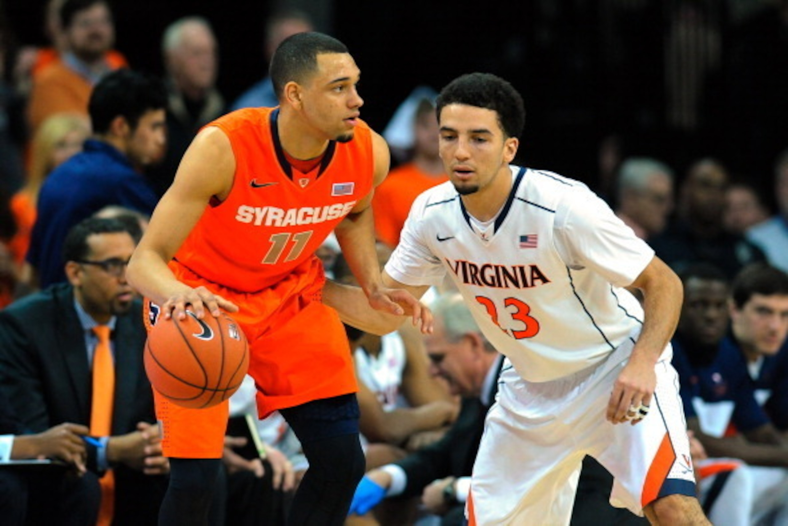 CHARLOTTESVILLE, VA - MARCH 01: Tyler Ennis #11 of the Syracuse Orange controls the ball against the defense of London Perrantes #23 of the Virginia Cavaliers during the first half at John Paul Jones Arena on March 1, 2014 in Charlottesville, Virginia. CHARLOTTESVILLE, VA - MARCH 01: Tyler Ennis #11 of the Syracuse Orange controls the ball against the defense of London Perrantes #23 of the Virginia Cavaliers during the first half at John Paul Jones Arena on March 1, 2014 in Charlottesville, Virginia.