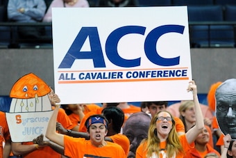 CHARLOTTESVILLE, VA - MARCH 01:  Virginia Cavaliers fans hold up signs prior to the game against the Syracuse Orange at John Paul Jones Arena on March 1, 2014 in Charlottesville, Virginia.  Virginia defeated Syracuse 75-56.  (Photo by Rich Barnes/Getty Im