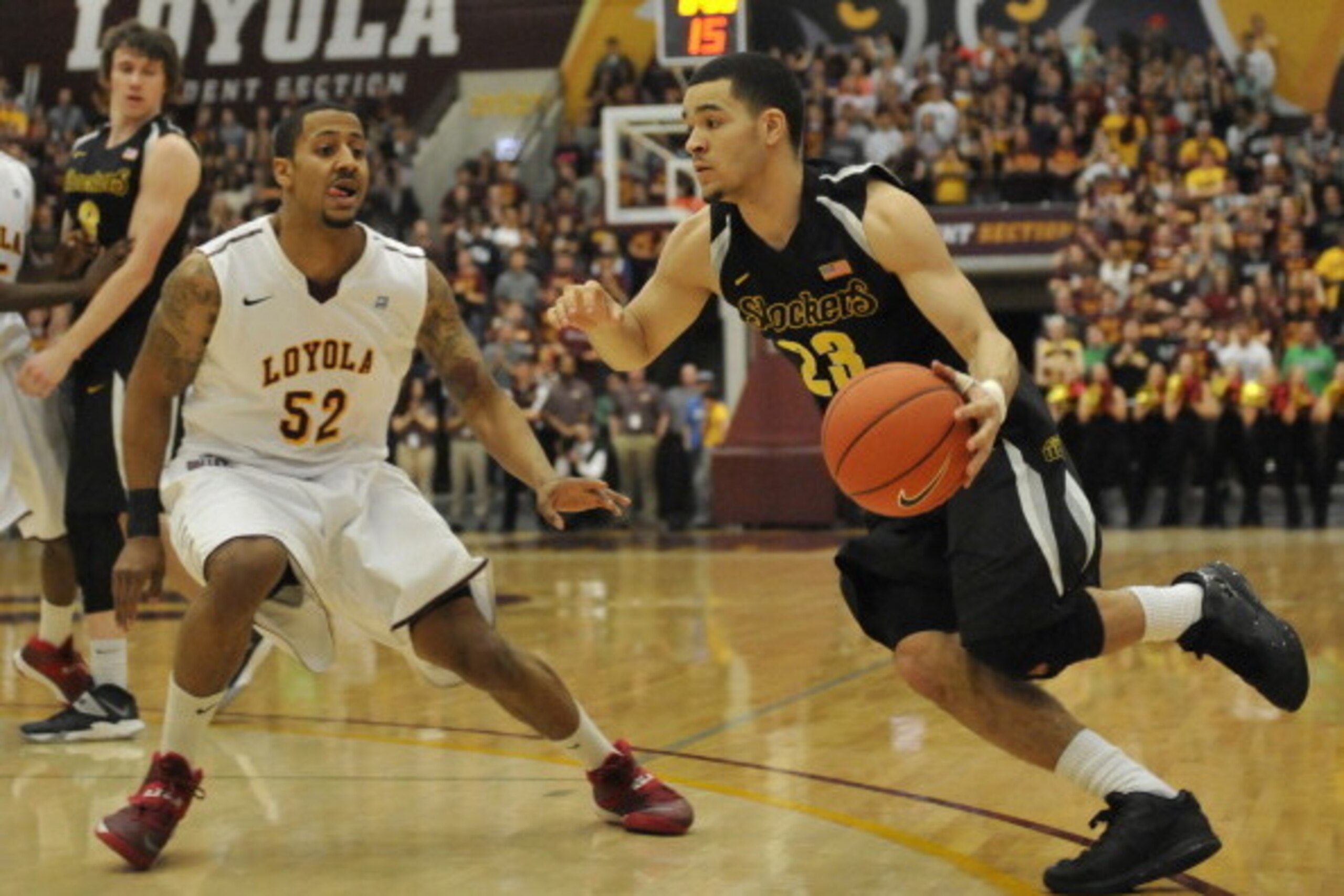 CHICAGO, IL - FEBRUARY 19:  Fred VanVleet #23 of the Wichita State Shockers is defended by Tony Nixon #52 of the Loyola-Chicago Ramblers on February 19, 2014 at the Joseph J. Gentile Arena in Chicago, Illinois. (Photo by David Banks/Getty Images)