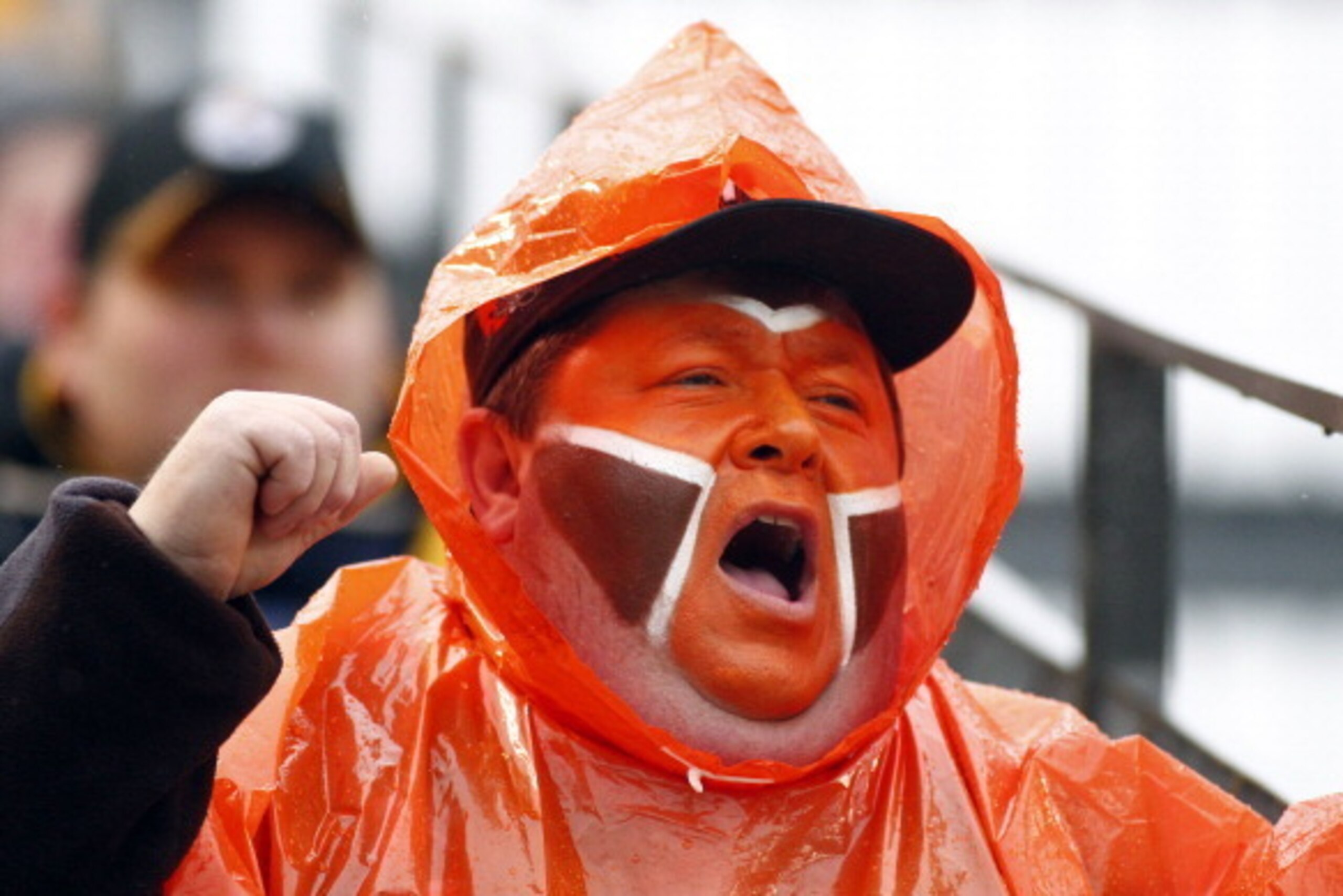 PITTSBURGH, PA - DECEMBER 29:  A Cleveland Browns fan cheers against the Pittsburgh Steelers during the game on December 29, 2013 at Heinz Field in Pittsburgh, Pennsylvania.  The Steelers defeated the Browns 20-7.  (Photo by Justin K. Aller/Getty Images)