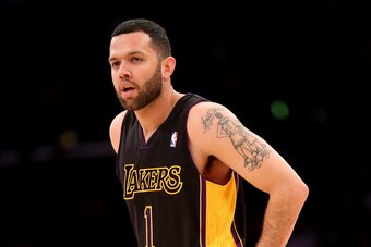 LOS ANGELES, CA - FEBRUARY 28:  Jordan Farmar #1 of the Los Angeles Lakers looks on during the game with the Sacramento Kings at Staples Center on February 28, 2014 in Los Angeles, California.  The Lakers won 126-122.   NOTE TO USER: User expressly acknow