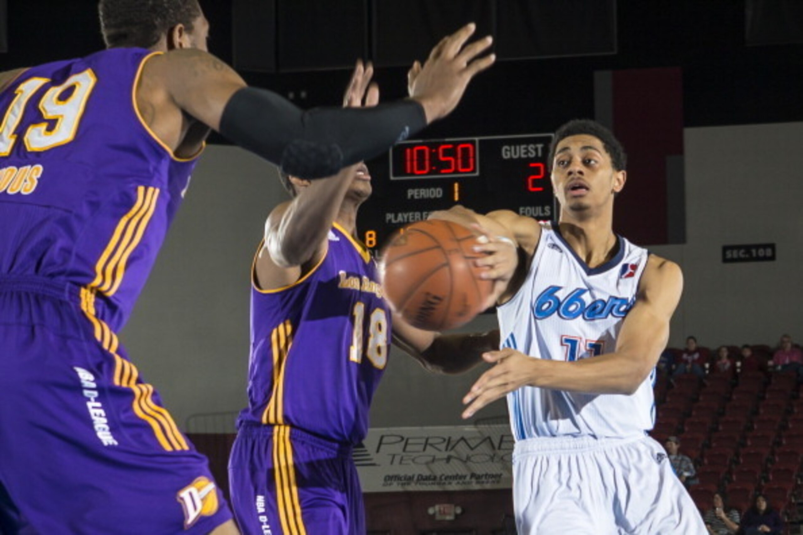 TULSA, OK - JANUARY 26: Jarrid Famous #19 and Elijah Millsap #18 of the Los Angeles D-Fenders try to defend a pass by Jeremy Lamb #11 of the Tulsa 66ers during the NBA D-League game on January 26, 2013 at the Spirit Bank Event Center in Bixby, Oklahoma. N