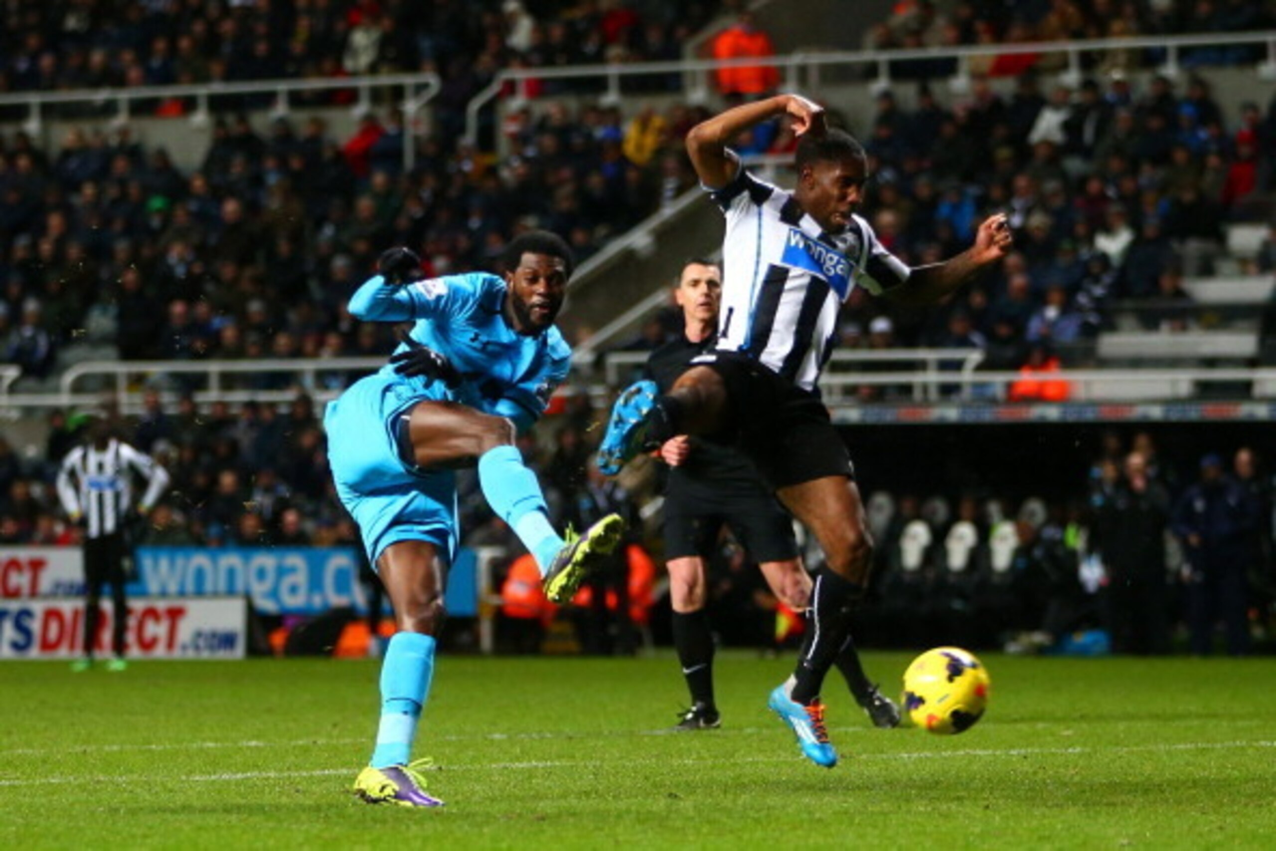 NEWCASTLE UPON TYNE, ENGLAND - FEBRUARY 12:  Emmanuel Adebayor of Tottenham Hotspur scores their third goal during the Barclays Premier League match between  Newcastle United and Tottenham Hotspur at St James' Park on February 12, 2014 in Newcastle upon T
