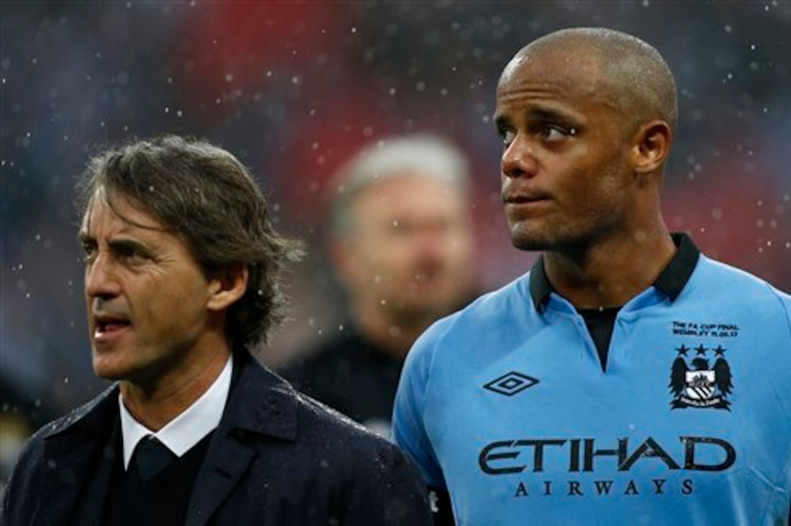 Mancini and Vincent Kompany look on as City lose out at Wembley.