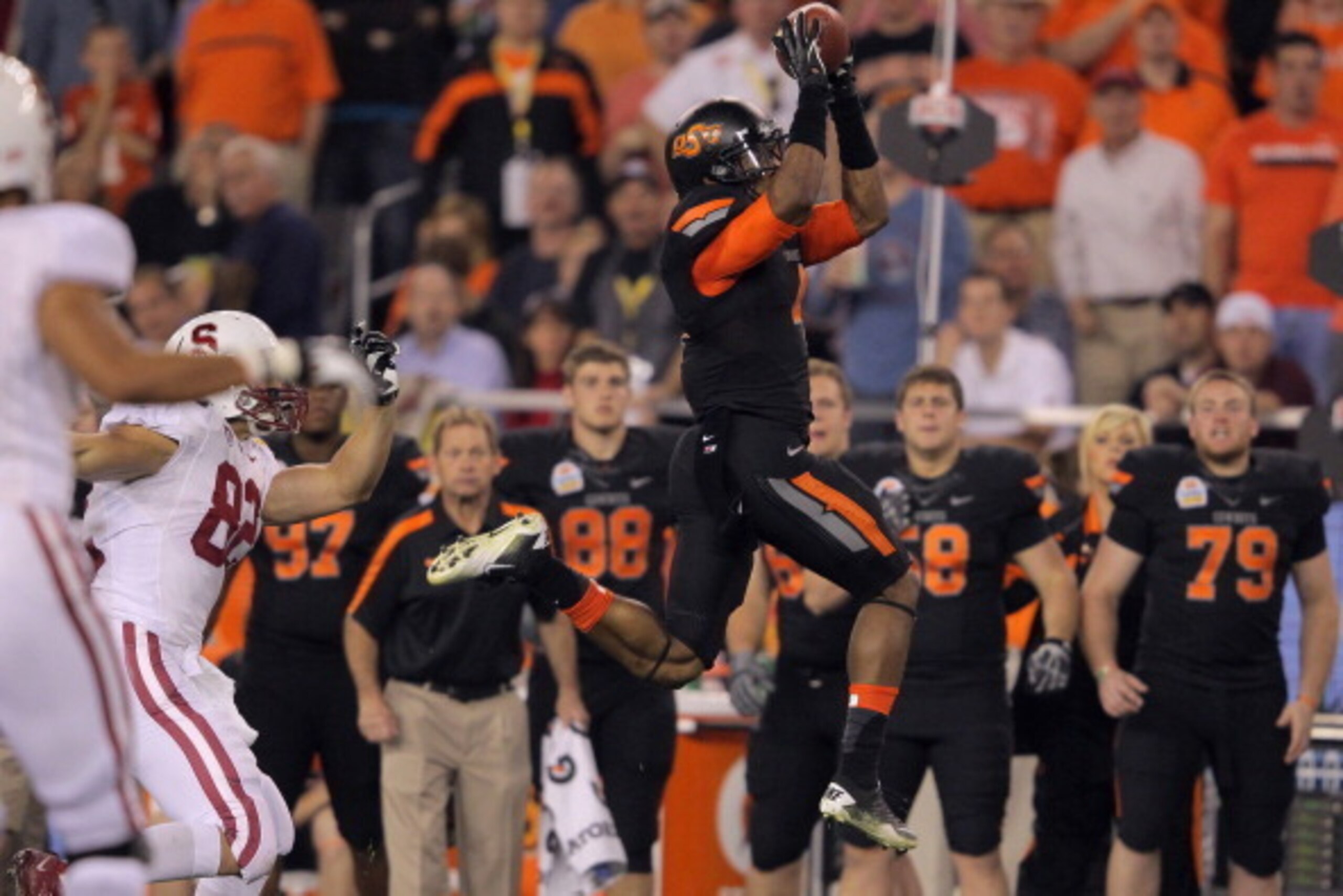 GLENDALE, AZ - JANUARY 02:  Justin Gilbert #4 of the Oklahoma State Cowboys intercepts a pass against the Stanford Cardinal during the Tostitos Fiesta Bowl on January 2, 2012 at University of Phoenix Stadium in Glendale, Arizona. Oklahoma State won 41-38 