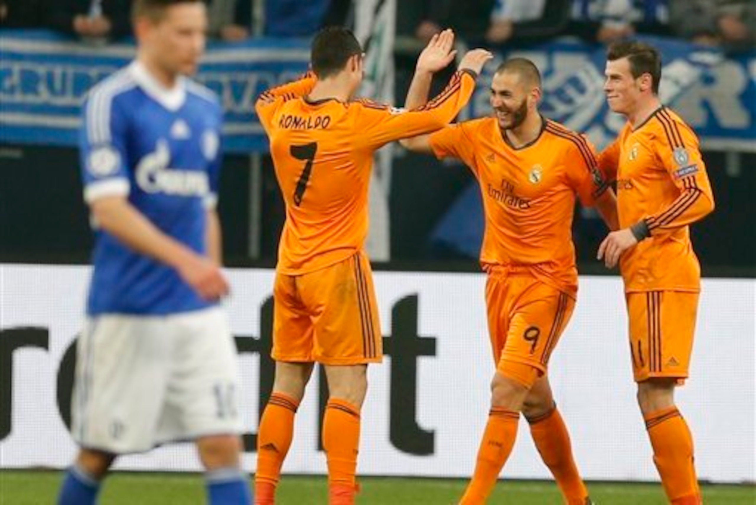 Bale celebrates his contribution as Benzema scores.