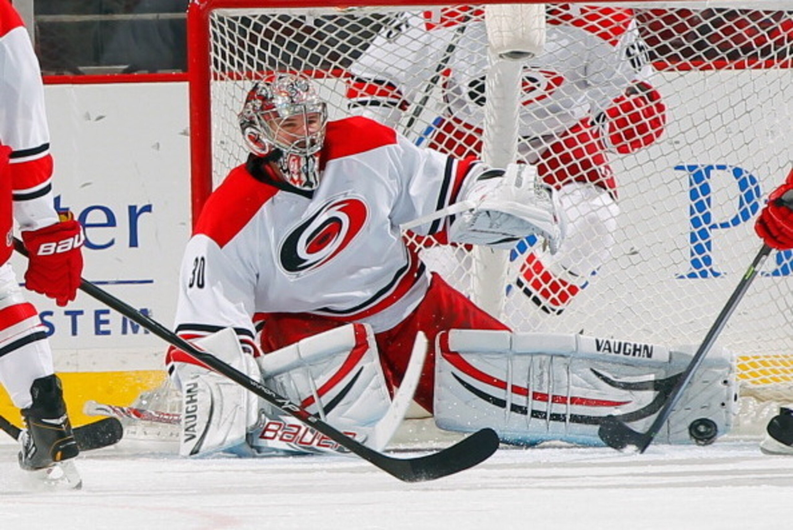 NEWARK, NJ - NOVEMBER 27: Cam Ward #30 of the Carolina Hurricanes makes a pad save against the New Jersey Devils during the game at the Prudential Center on November 27, 2013 in Newark, New Jersey. (Photo by Andy Marlin/NHLI via Getty Images)
