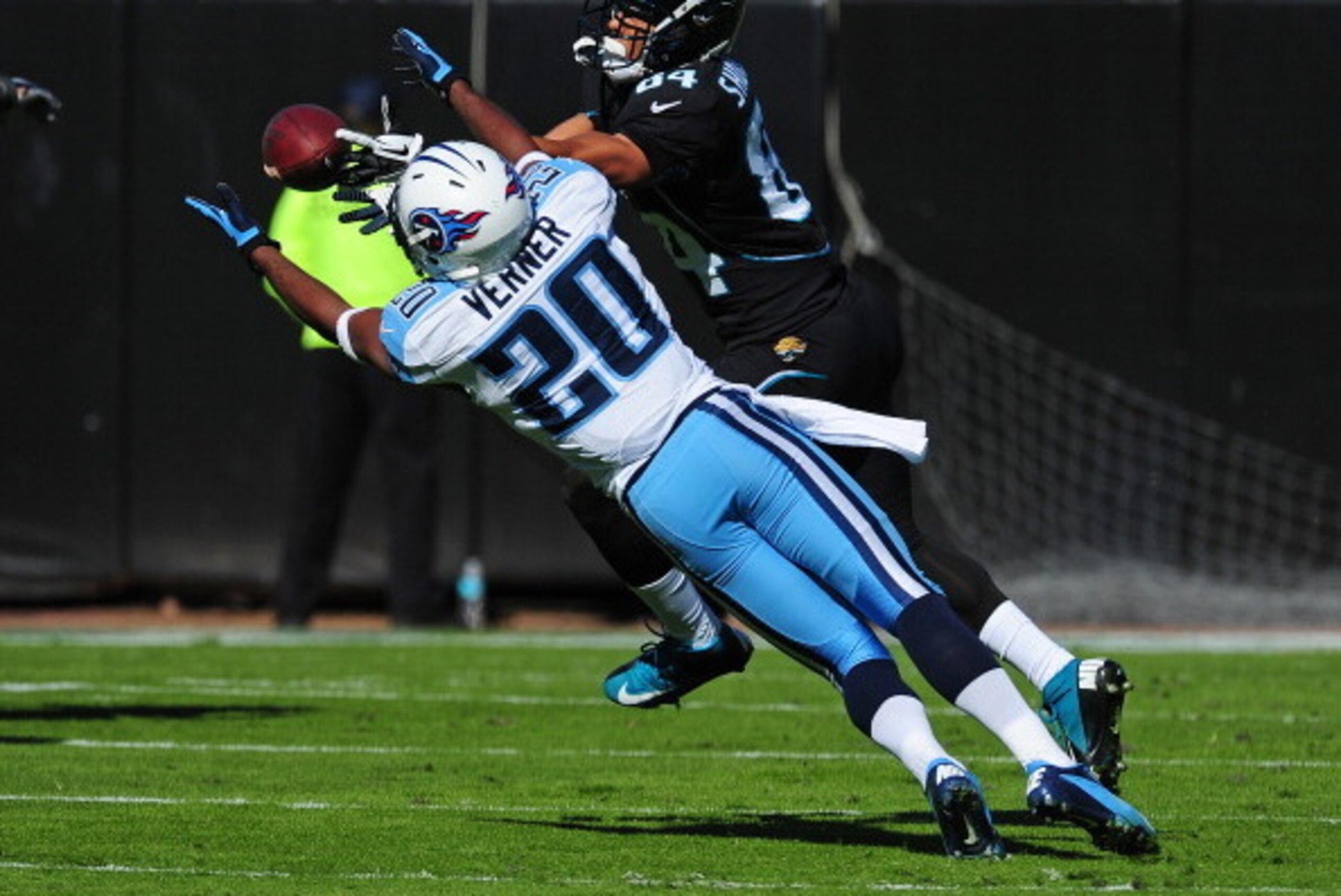 JACKSONVILLE, FL - NOVEMBER 25: Alterraun Verner #20 of the Tennessee Titans intercepts a pass intended for Cecil Shorts III #84 of the Jacksonville Jaguars at EverBank Field on November 25, 2012 in Jacksonville, Florida  (Photo by Scott Cunningham/Getty 