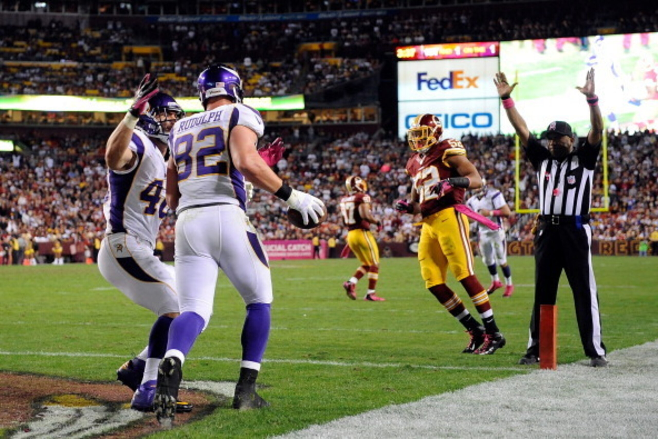 LANDOVER, MD - OCTOBER 14:  Kyle Rudolph #82 celebrates with Rhett Ellison #40 of the Minnesota Vikings after scoring a 1-yard touchdown on a pass from Christian Ponder #7 in the second half against the Washington Redskins at FedExField on October 14, 201