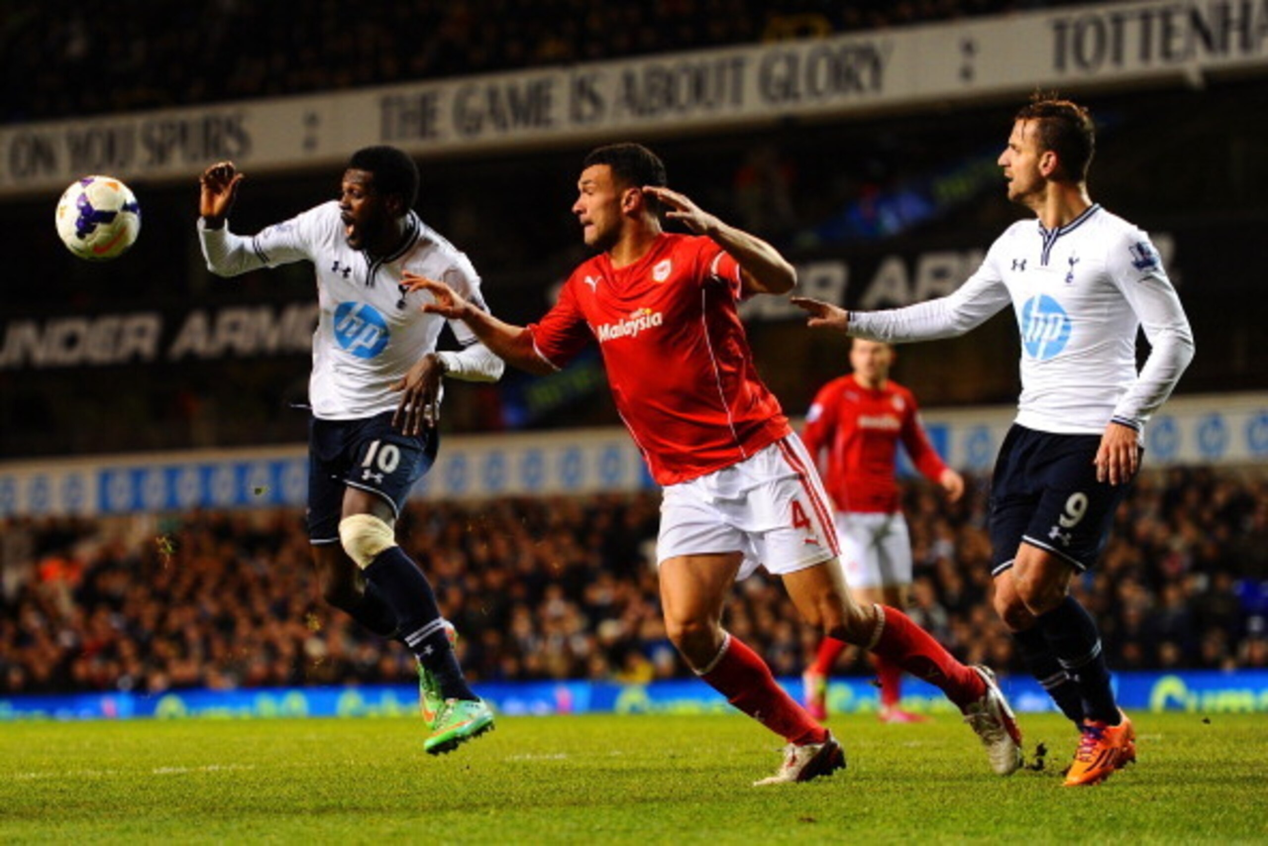 LONDON, ENGLAND - MARCH 02: Emmanuel Adebayor of Tottenham Hotspur, Steven Caulker of Cardiff City and Roberto Soldado of Tottenham Hotspur compete for the ball during the Barclays Premier League match between Tottenham Hotspur and Cardiff City at White LONDON, ENGLAND - MARCH 02: Emmanuel Adebayor of Tottenham Hotspur, Steven Caulker of Cardiff City and Roberto Soldado of Tottenham Hotspur compete for the ball during the Barclays Premier League match between Tottenham Hotspur and Cardiff City at White