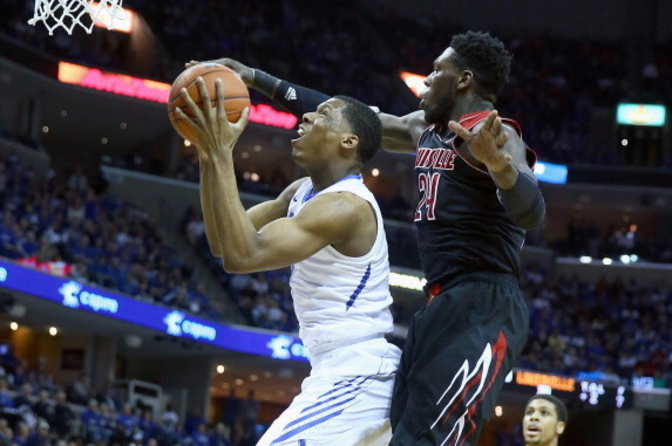 MEMPHIS, TN - MARCH 01:  Nick King #5 of the Memphis Tigers shoots the ball while defended by Montrezl Harrell #24 of the Louisville Cardinals during the game at FedExForum on March 1, 2014 in Memphis, Tennessee.  (Photo by Andy Lyons/Getty Images)