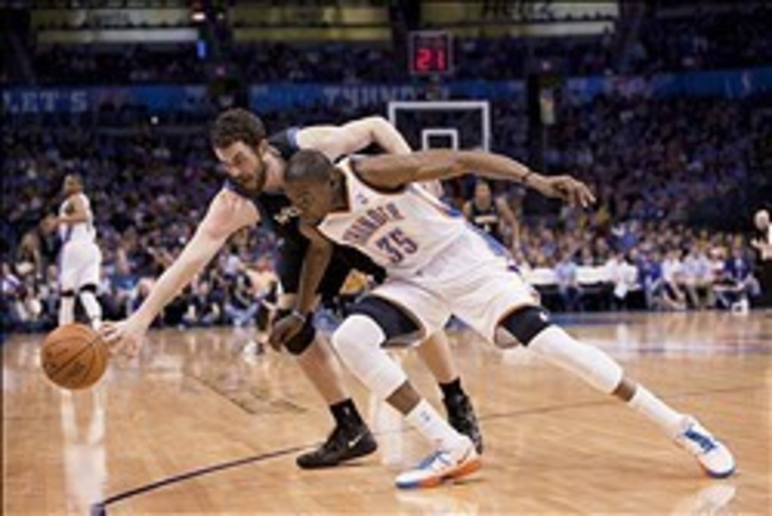 Mar, 23, 2012; Oklahoma City  OK, USA; Minnesota Timberwolves power forward Kevin Love (42) and Oklahoma City Thunder small forward Kevin Durant (35) fight for the loose ball during the third quarter at Chesapeake Energy Arena Mandatory Credit: Richard Ro