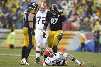 PITTSBURGH, PA - DECEMBER 29:  Cameron Heyward #97 and Brett Keisel #99 of the Pittsburgh Steelers celebrate after causing a fumble against Jason Campbell #17 of the Cleveland Browns during the game on December 29, 2013 at Heinz Field in Pittsburgh, Penns